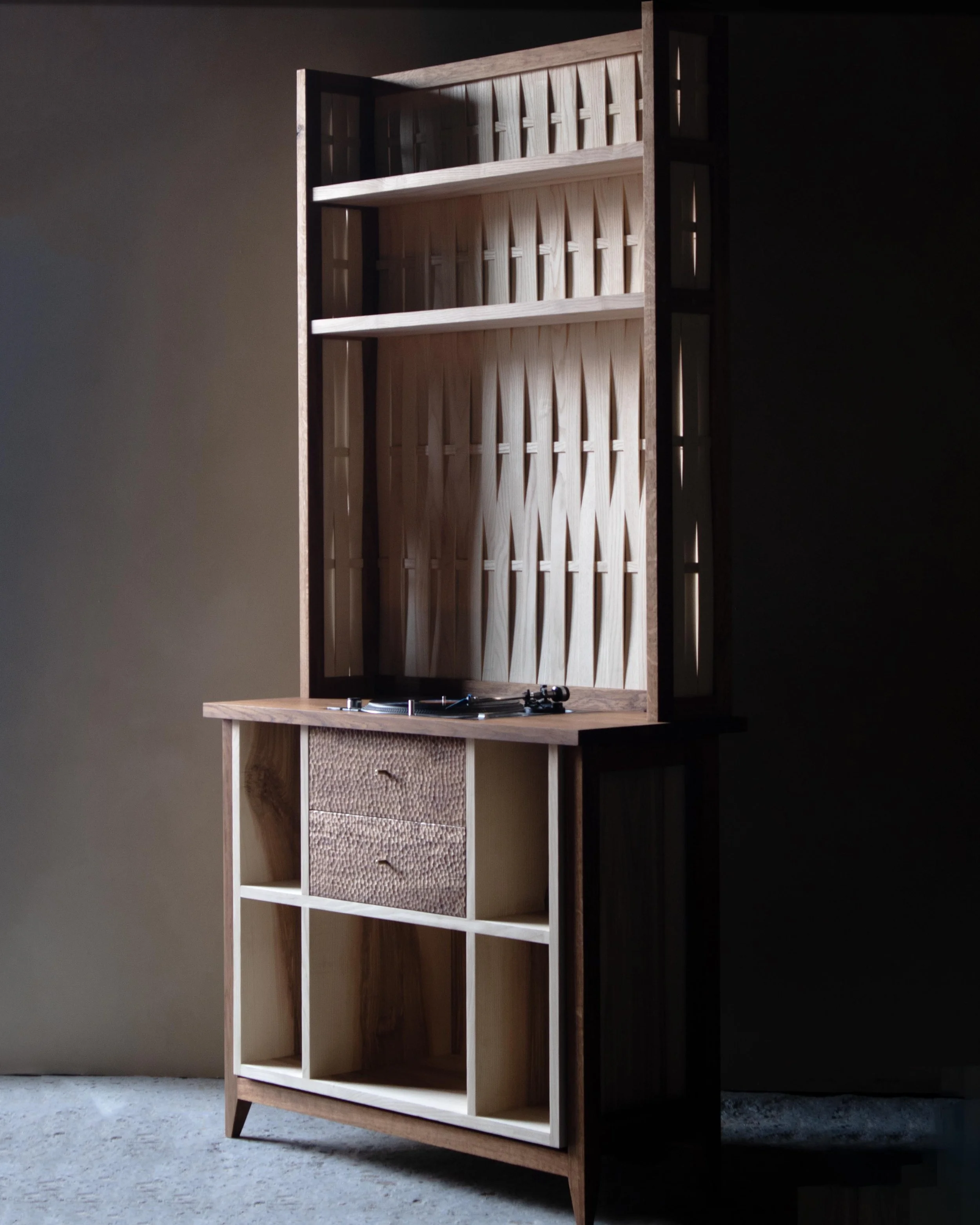 Handcrafted solid wood record cabinet made from British-grown brown oak and ash, featuring chip-carved drawers and woven ash detailing