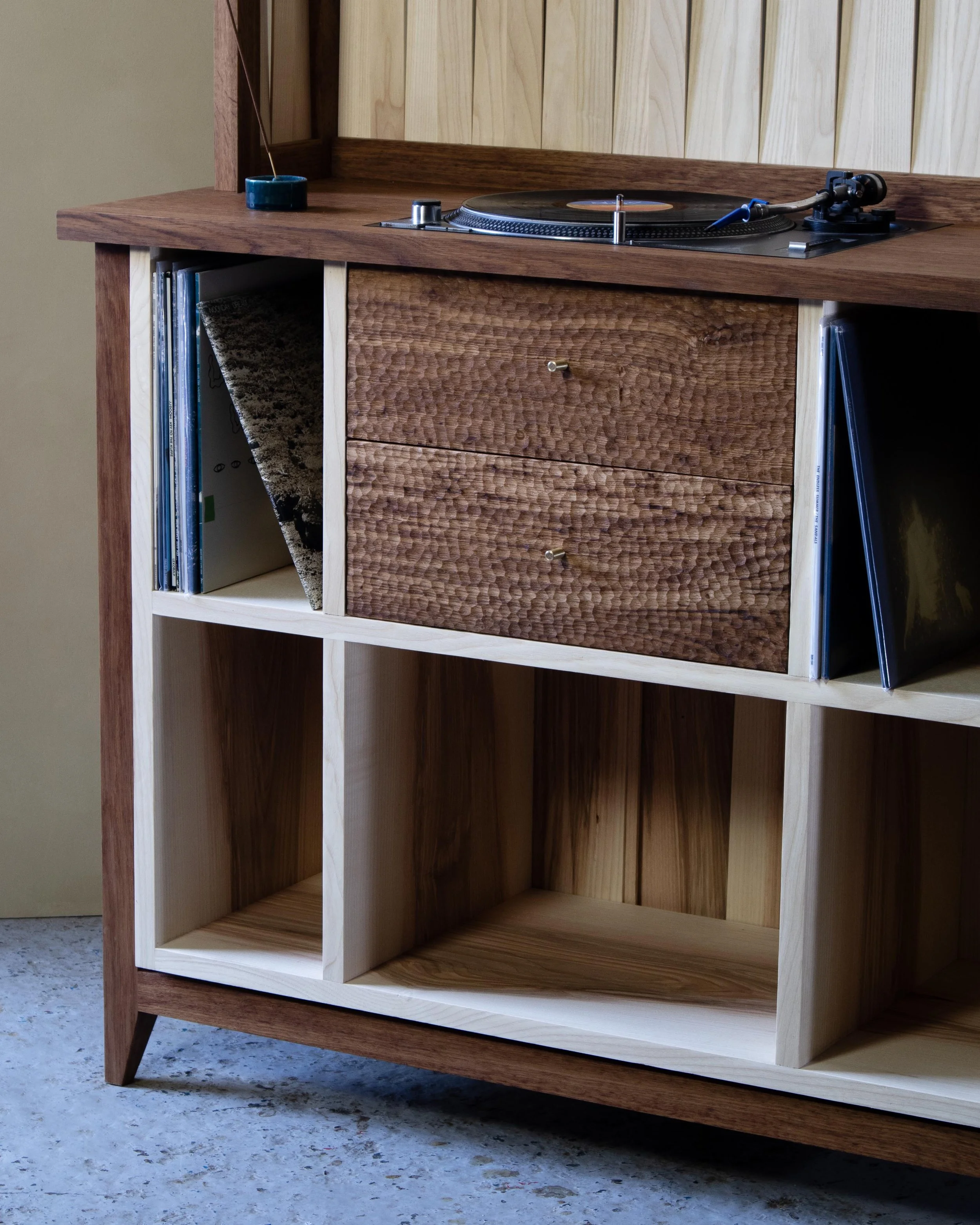 Handcrafted solid wood record cabinet made from British-grown brown oak and ash, featuring chip-carved drawers and woven ash detailing