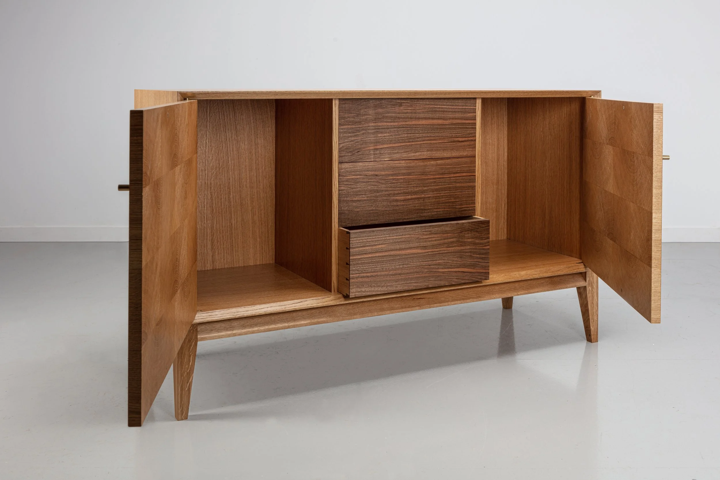 Oak end grain doors, brass door handle, and English walnut drawer fronts, Handmade oak sideboard. 