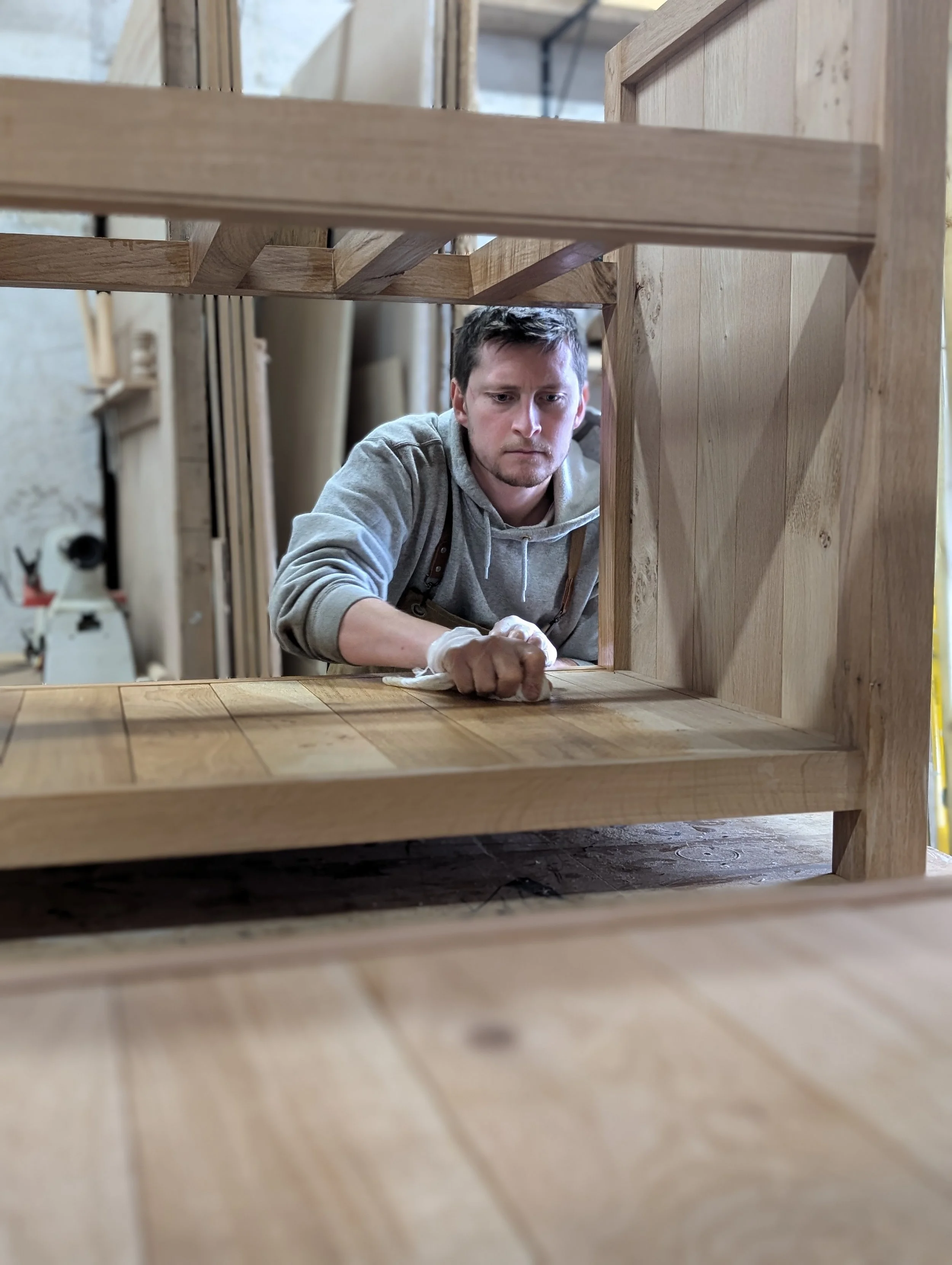 Andrew Strickland, founder of Strickland & Whyte working on a bespoke solid oak Kitchen in their south west based workshop.