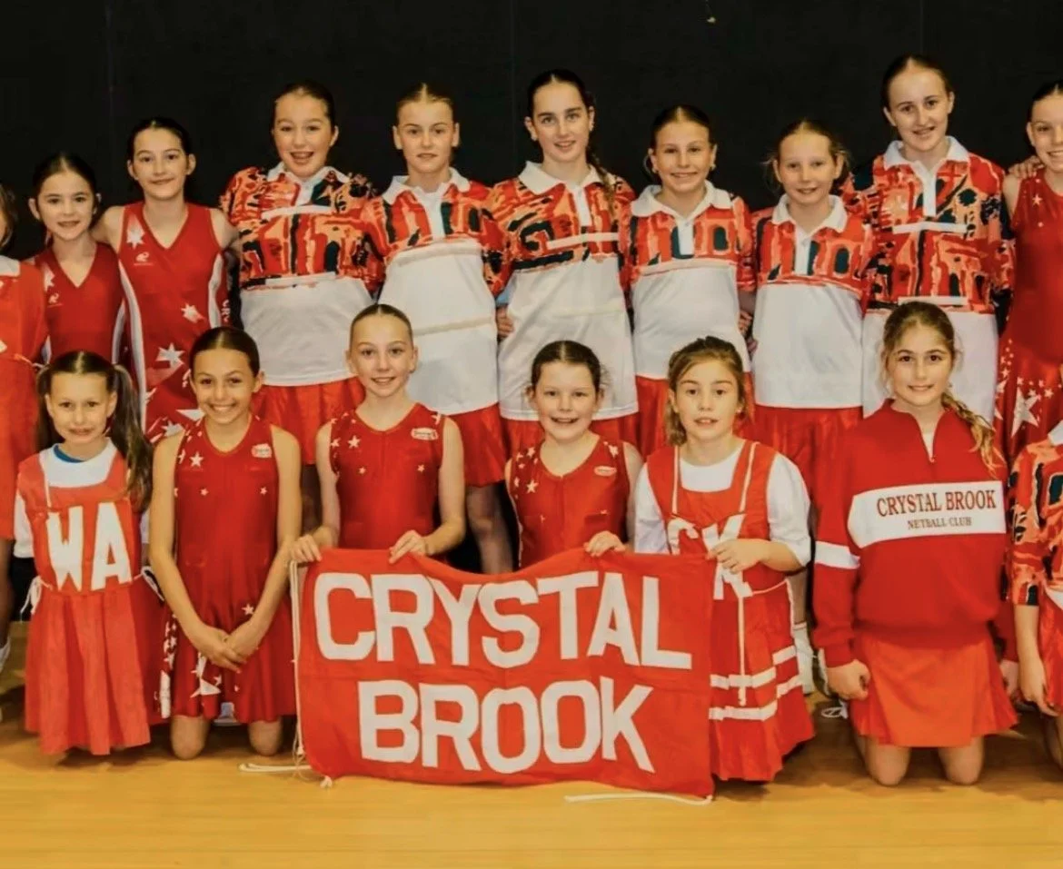 Young netballers playing netball on a saturday morning