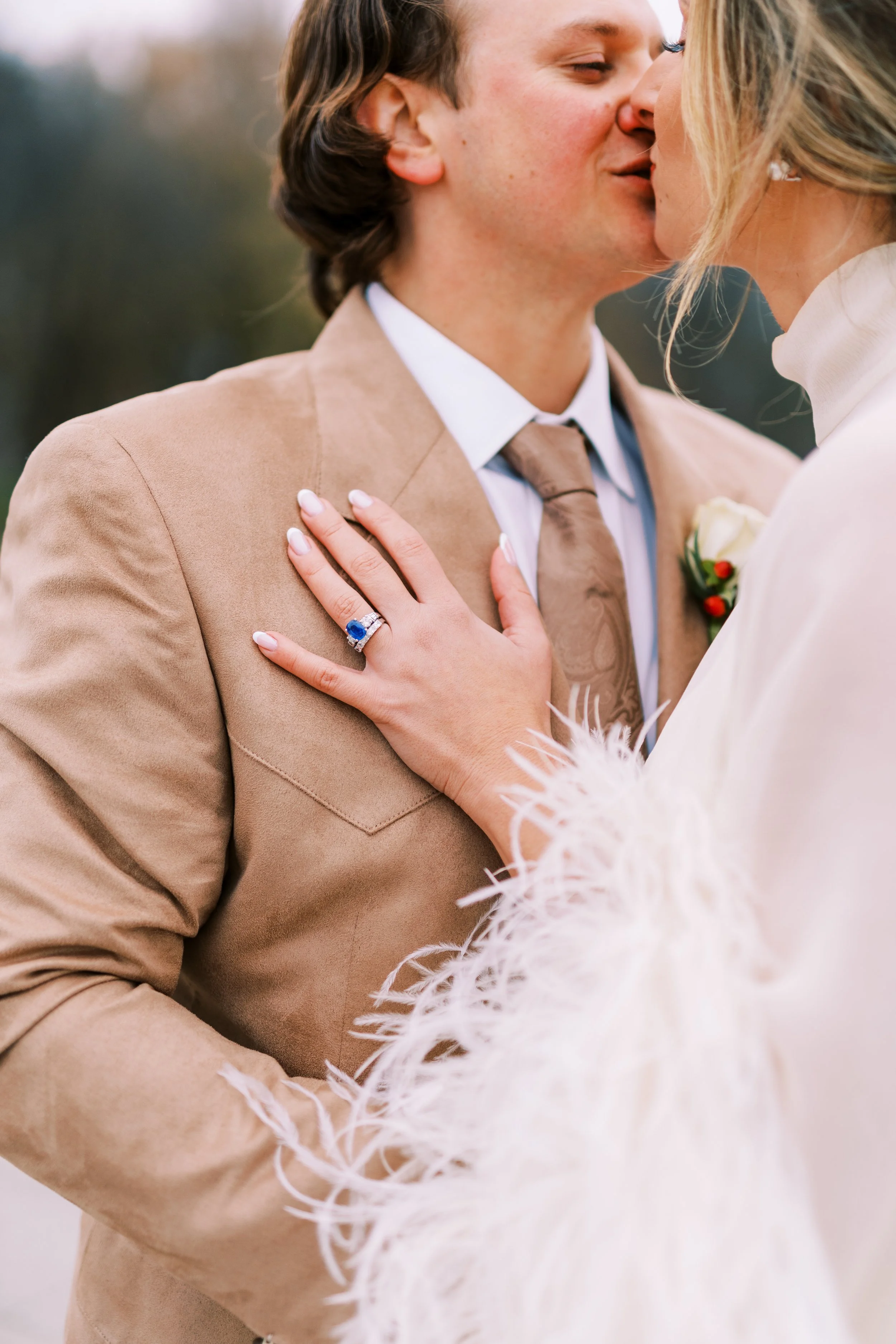 Close-up of the bride and groom sharing a tender kiss