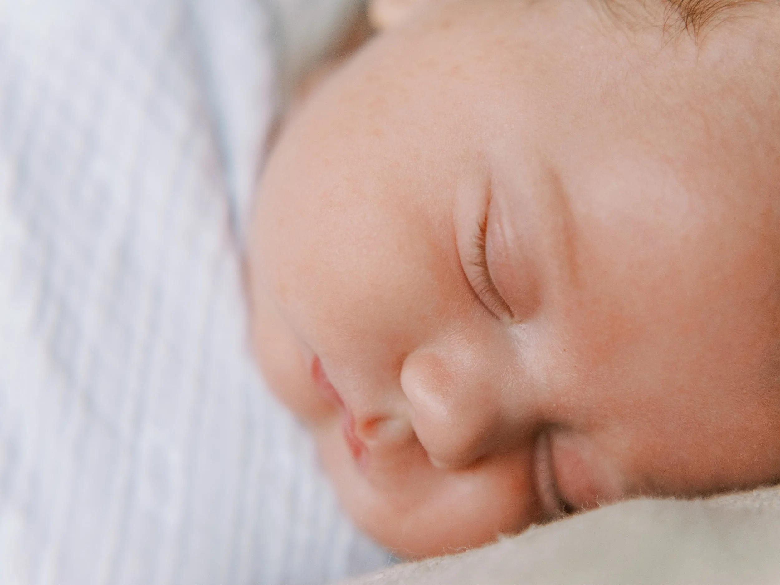 Portrait of newborn baby with eyes wide open lying on a soft blanket, Roswell, Georgia
