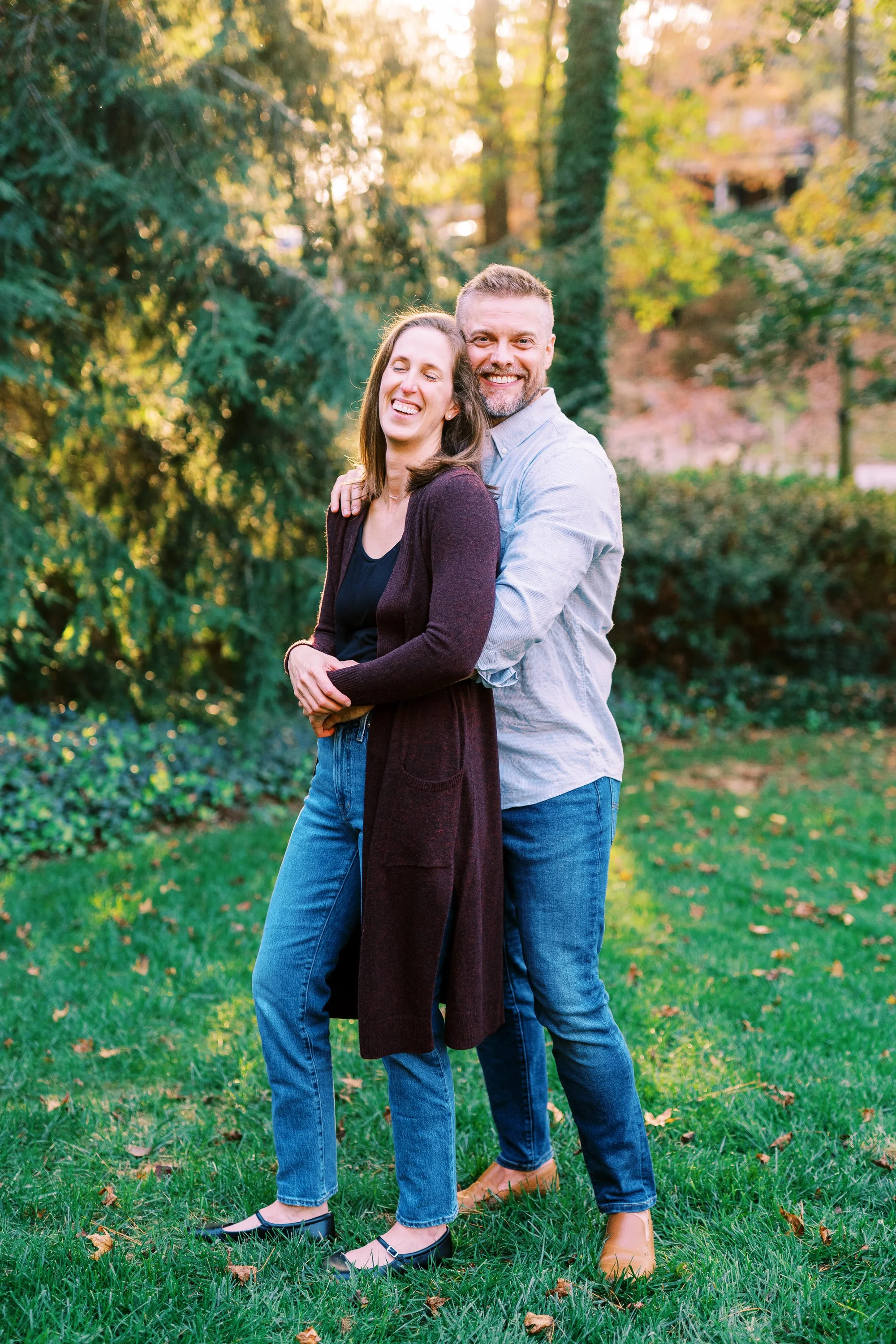 Full-length portrait of Holly and Chris standing together outdoors in Dunwoody, Georgia