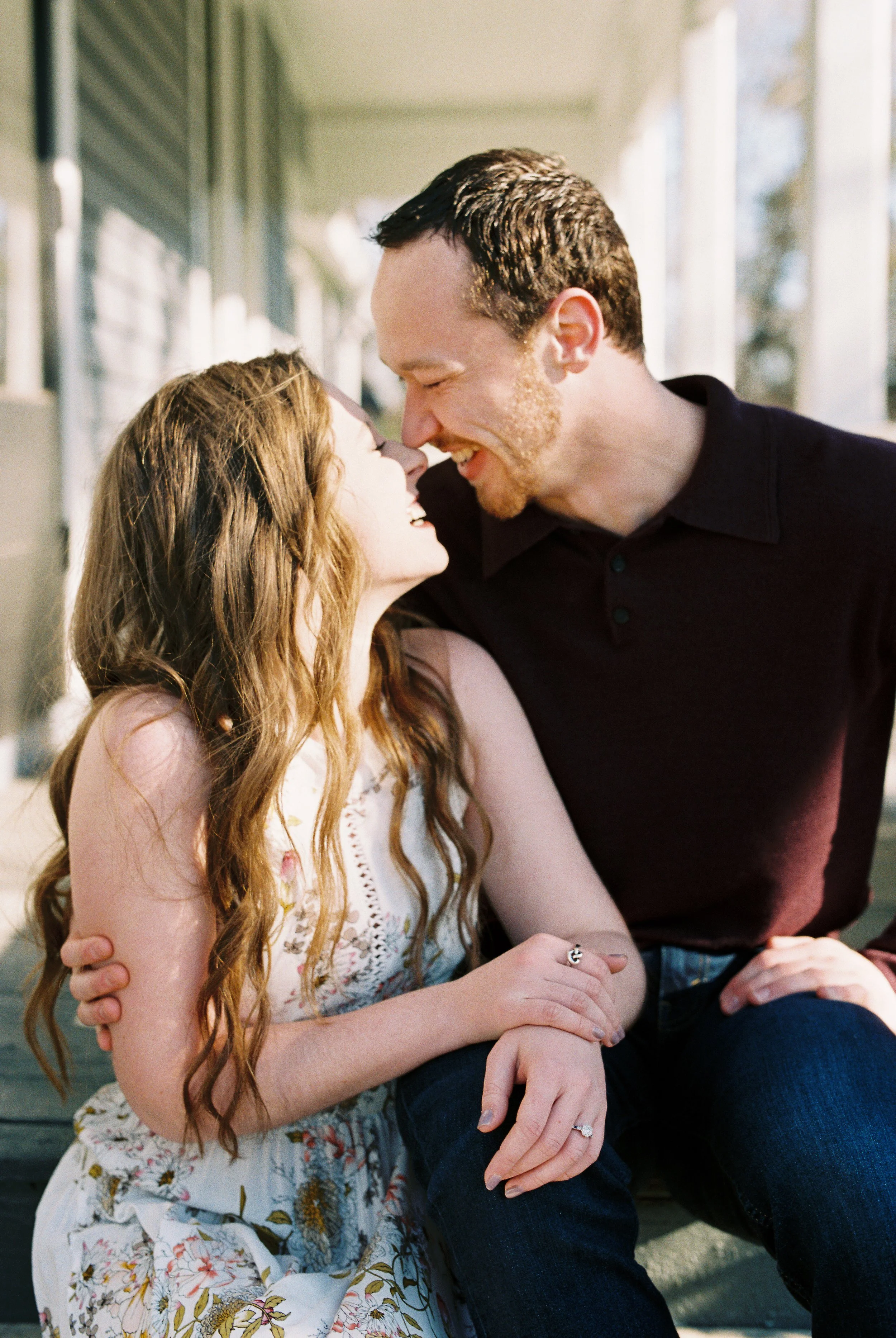 Conner laughs nose to nose with Maddie on the porch steps of a historic home in Dallas, Georgia.