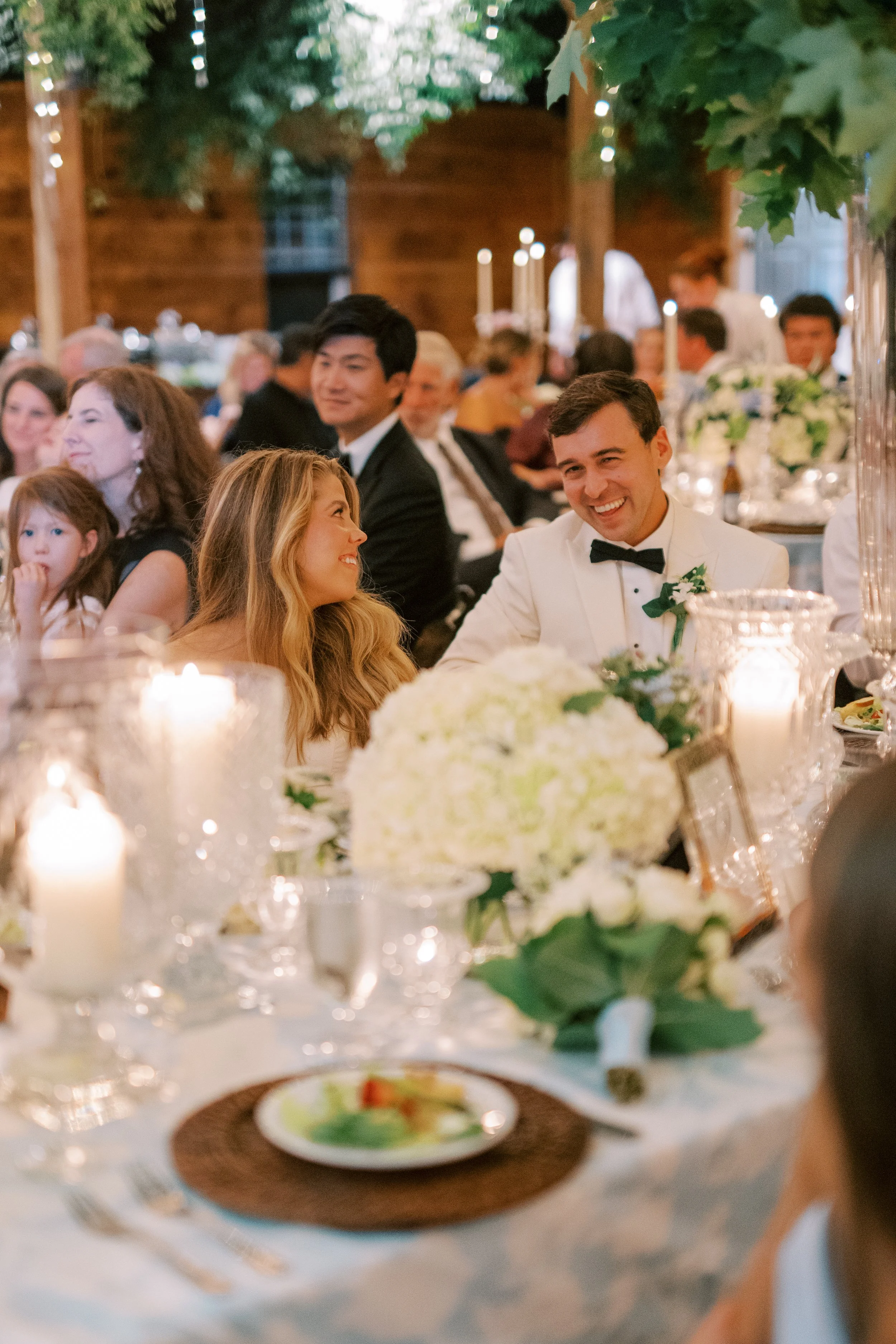 Bridal party seated together at the head table during dinner