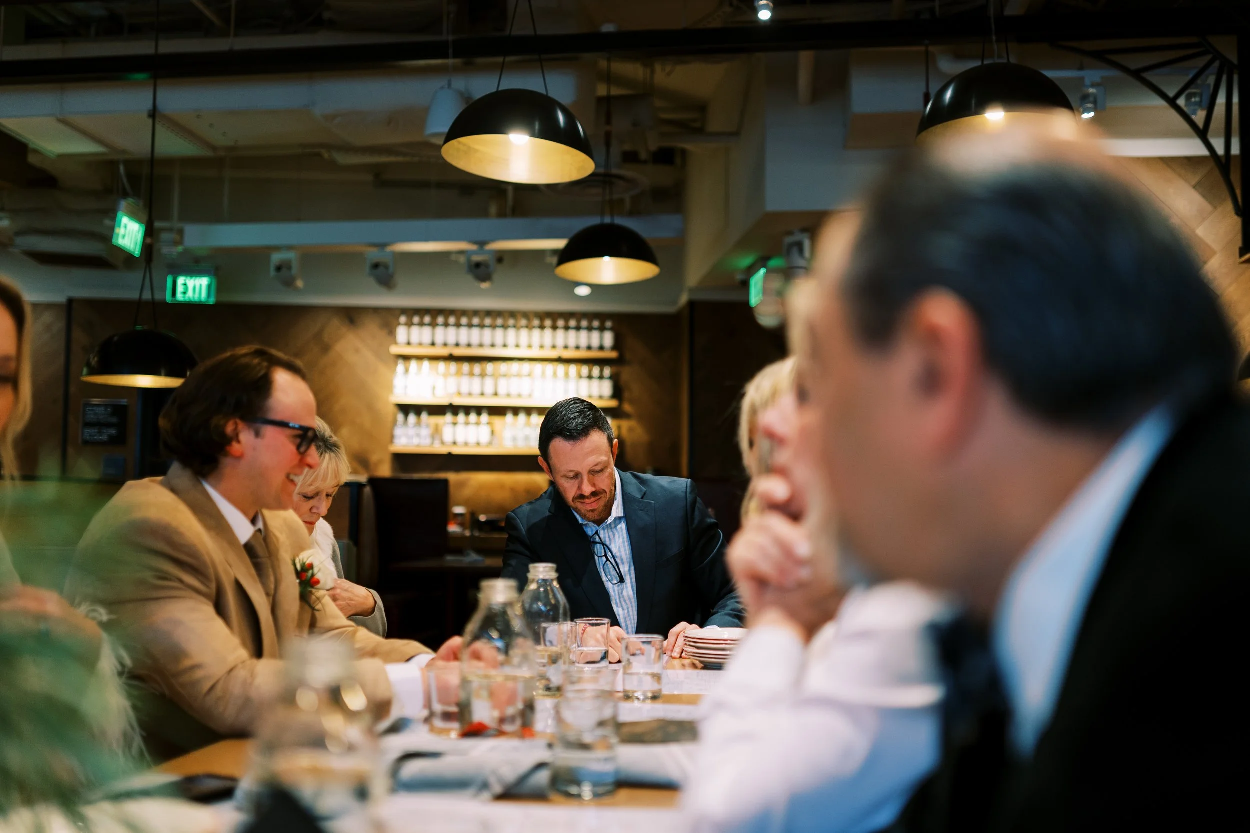 Guests enjoying dinner together at the restaurant reception table