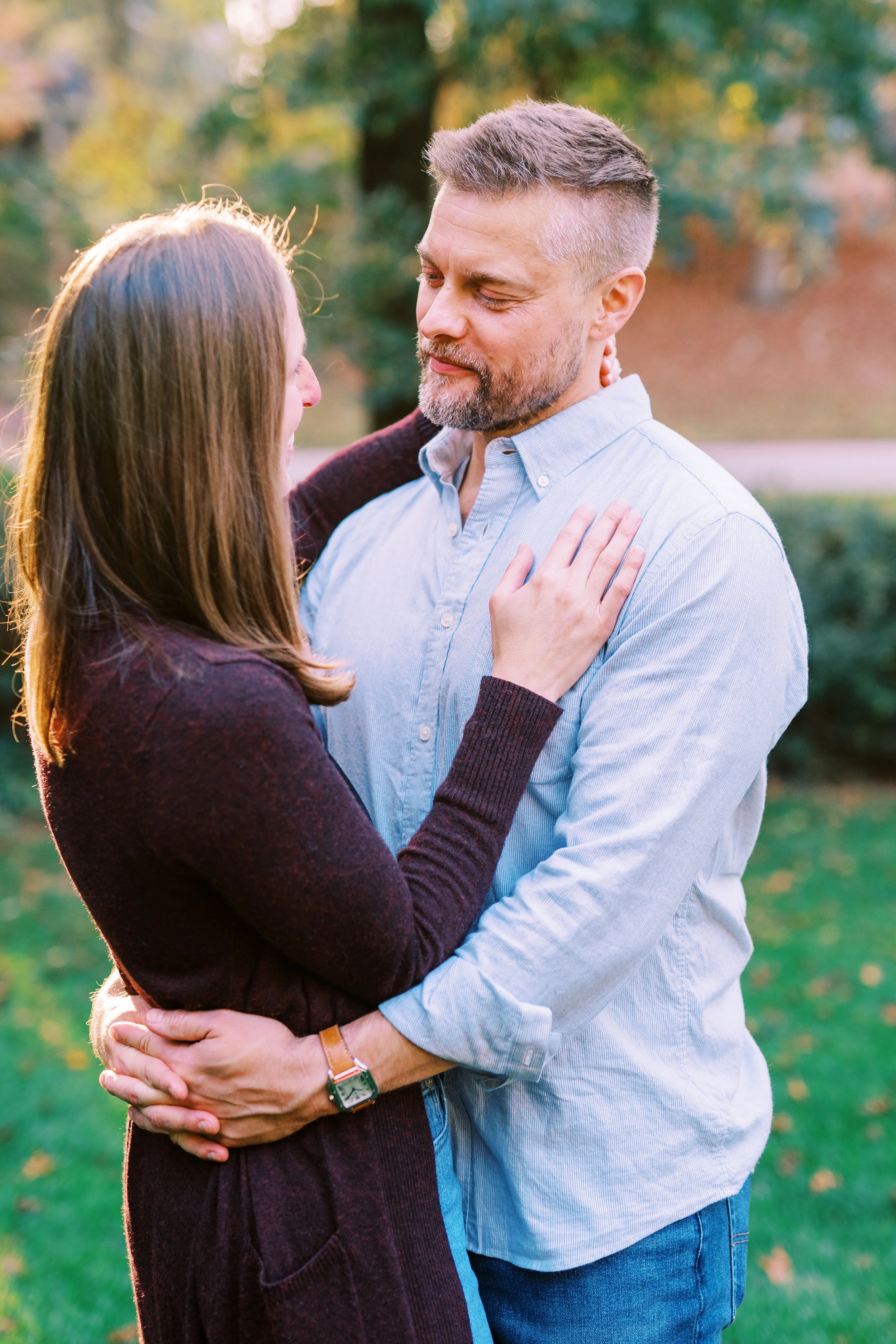 Holly and Chris embracing outdoors in their backyard in Dunwoody, Georgia