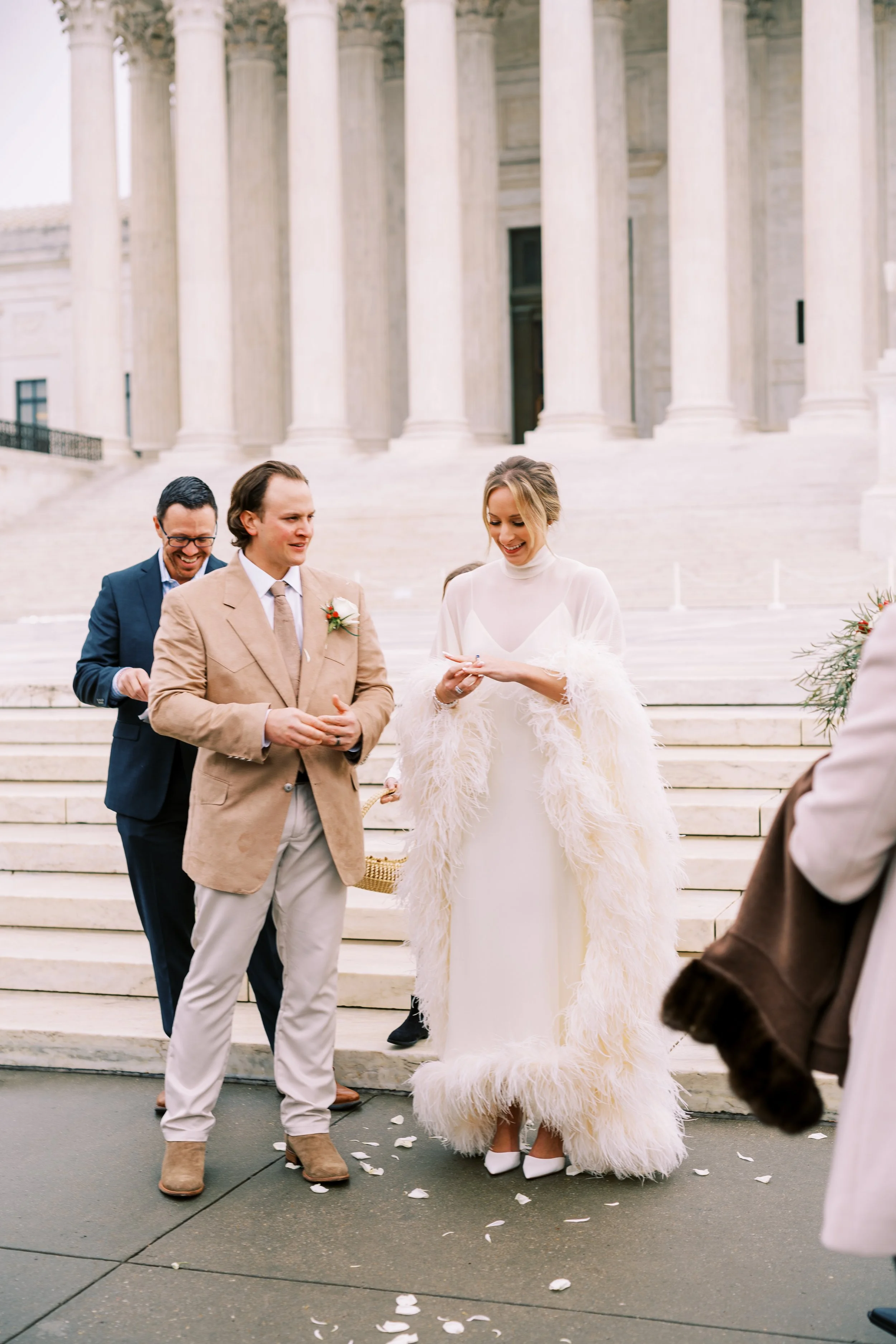 Bride and groom standing together near the steps of a Washington DC memorial