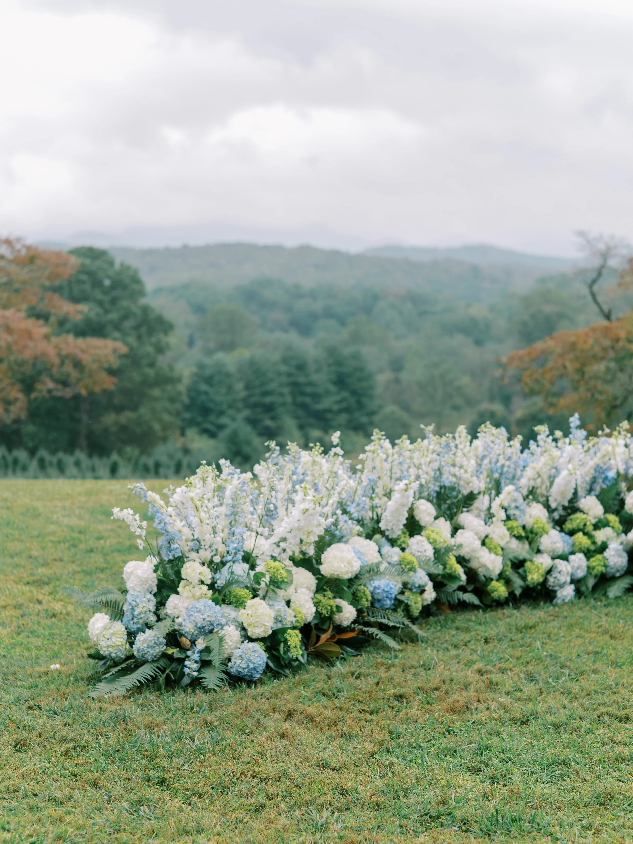 Ceremony floral arch decor with mountain views in the background