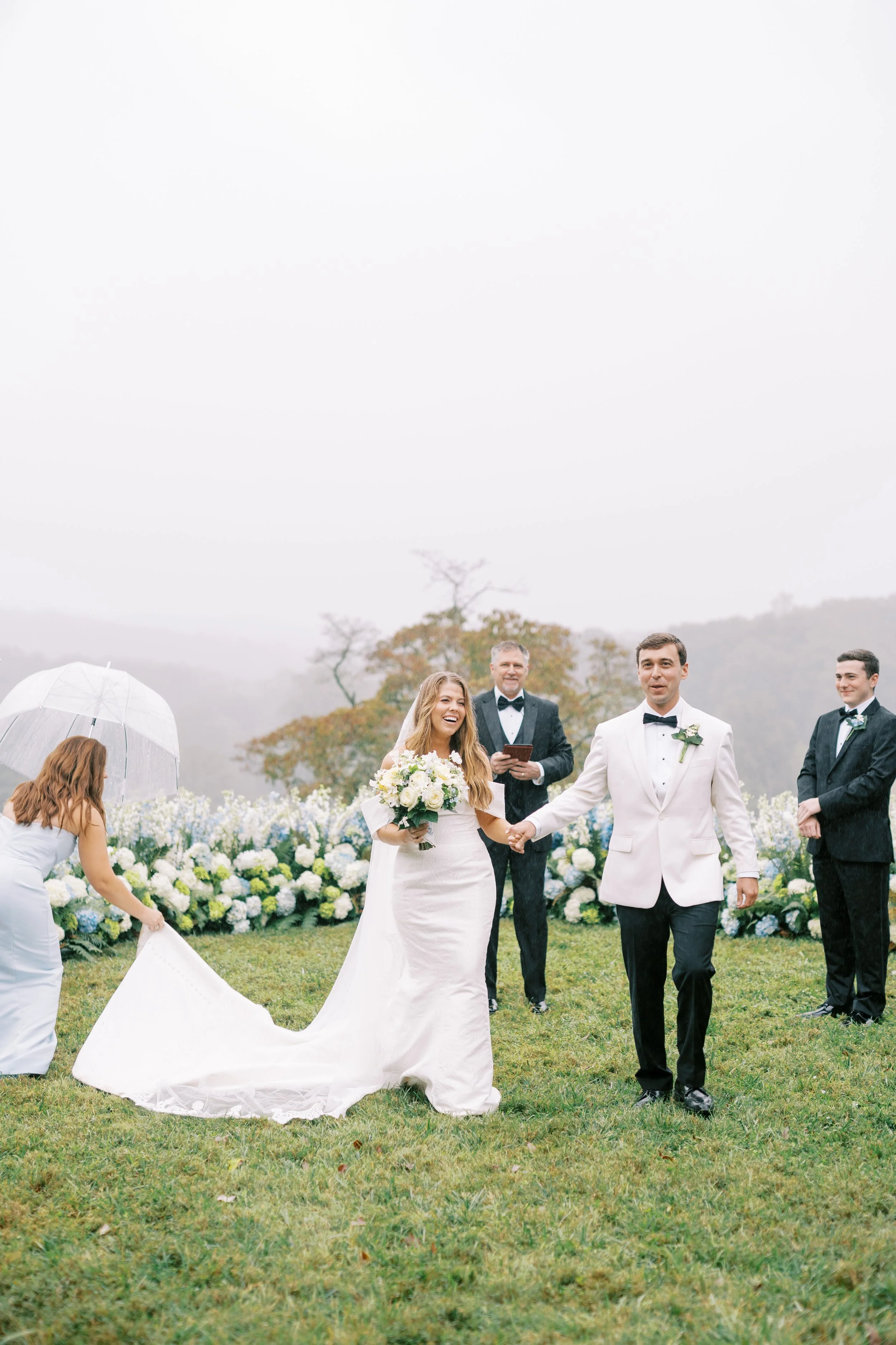 Wide shot of the ceremony vows with the mountain backdrop