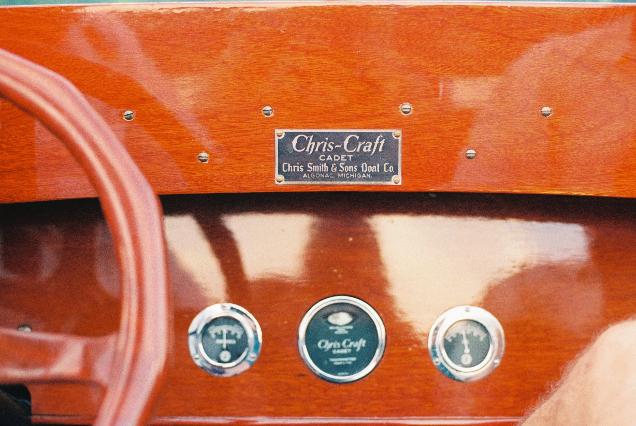 Chris-Craft wooden boat dashboard with vintage gauges, a classic lake boat detail
