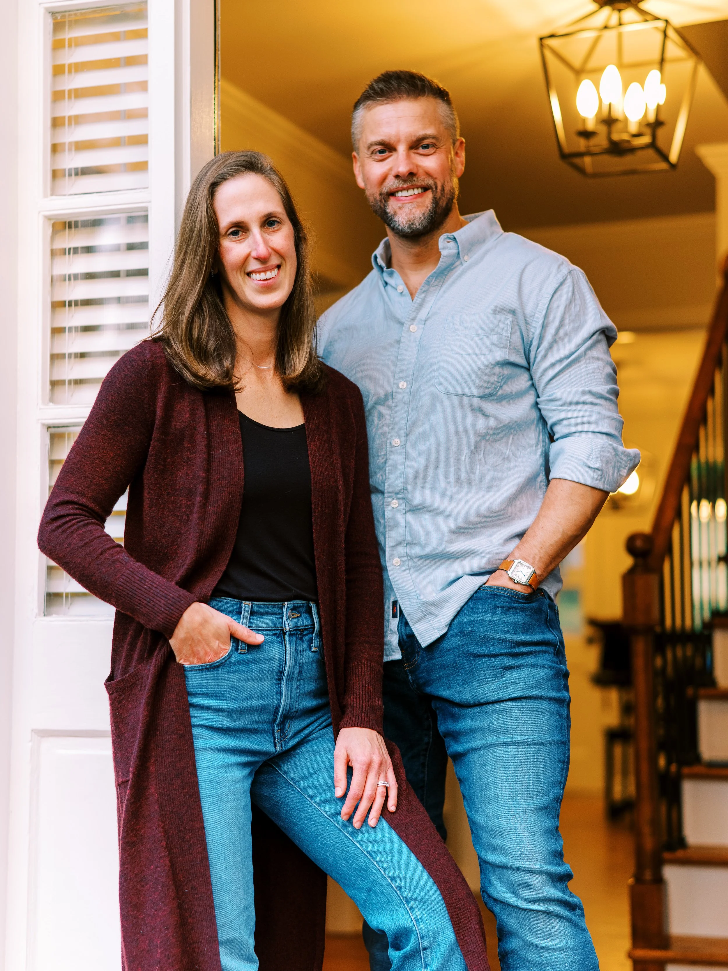 Holly and Chris posing together in the foyer of their Dunwoody, Georgia home
