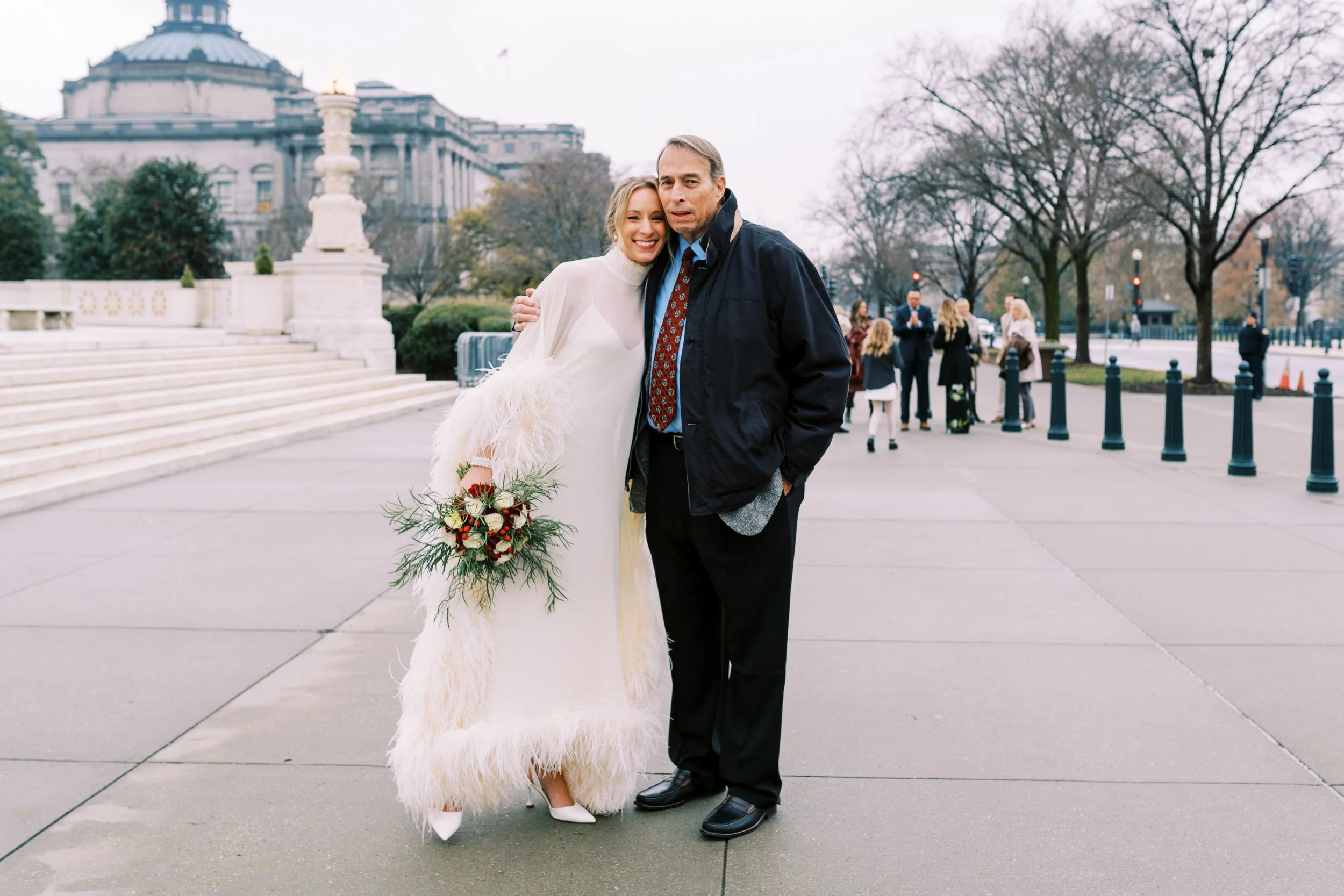 Bride posing with a family member on a Washington DC memorial plaza