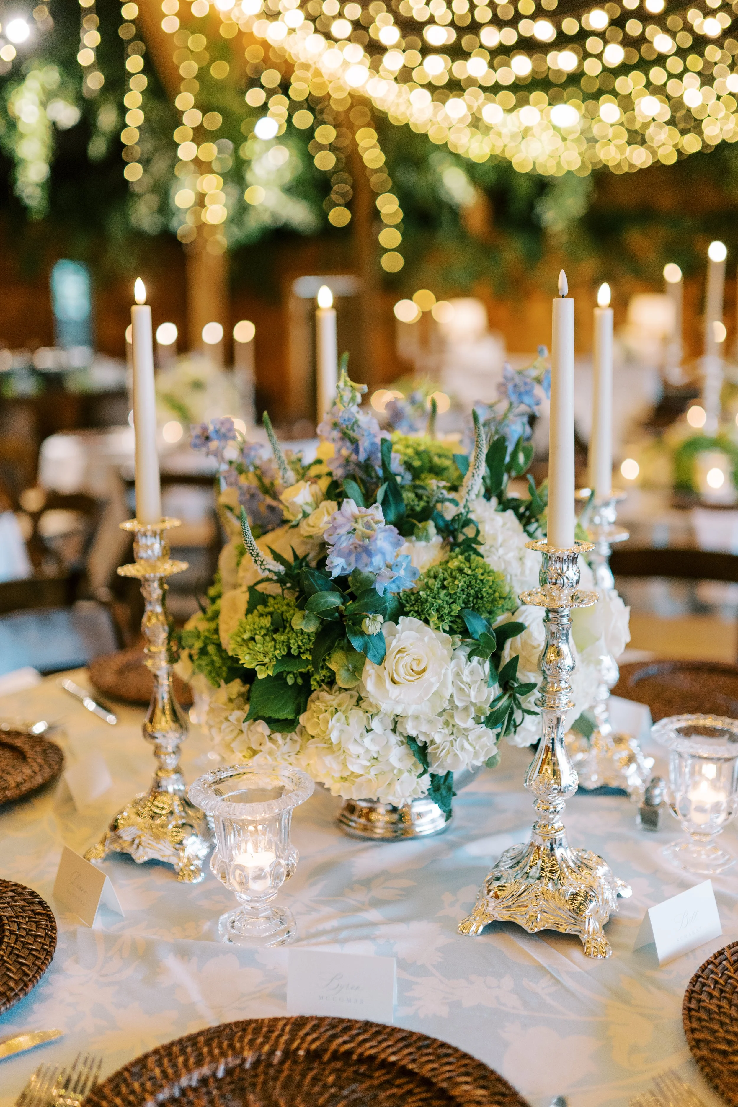 Sweetheart table close-up with floral centerpiece and candles