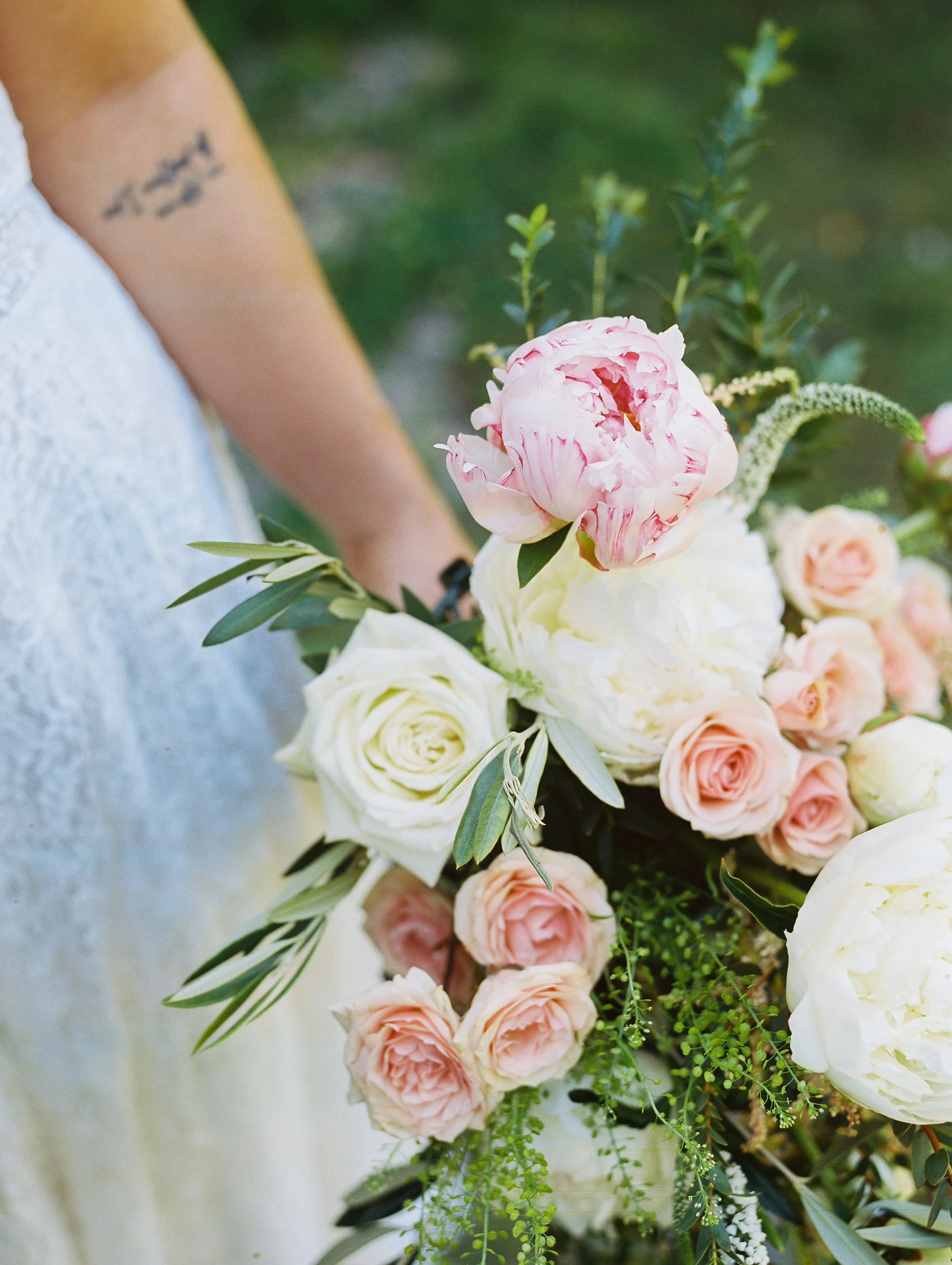 Close-up of the bride's pink and white rose and peony bouquet