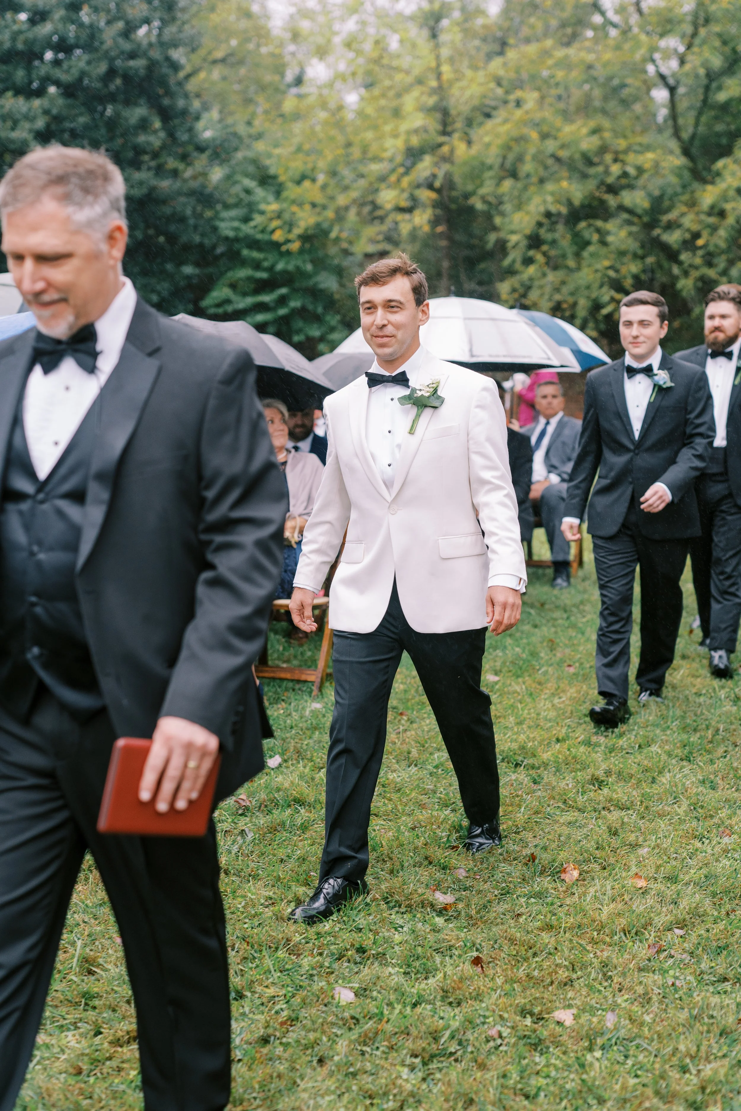 Groom walking with his father before the ceremony