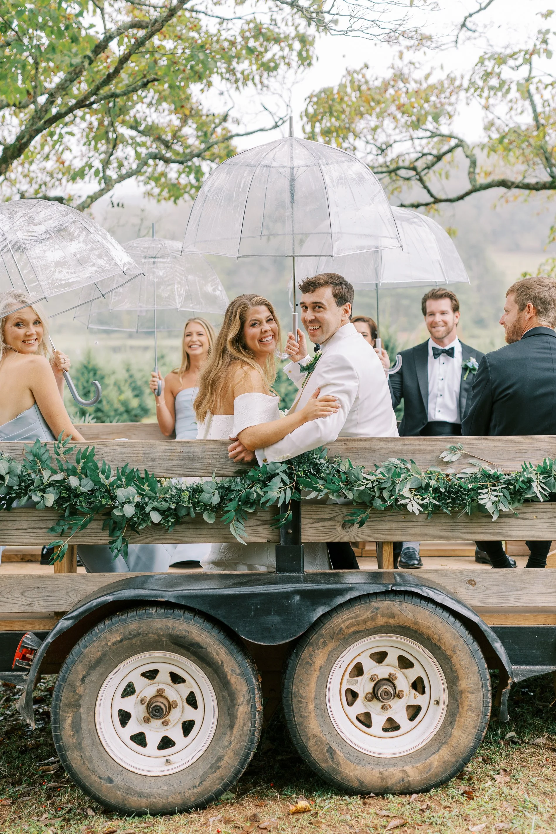 Wedding party riding together on a decorated trailer