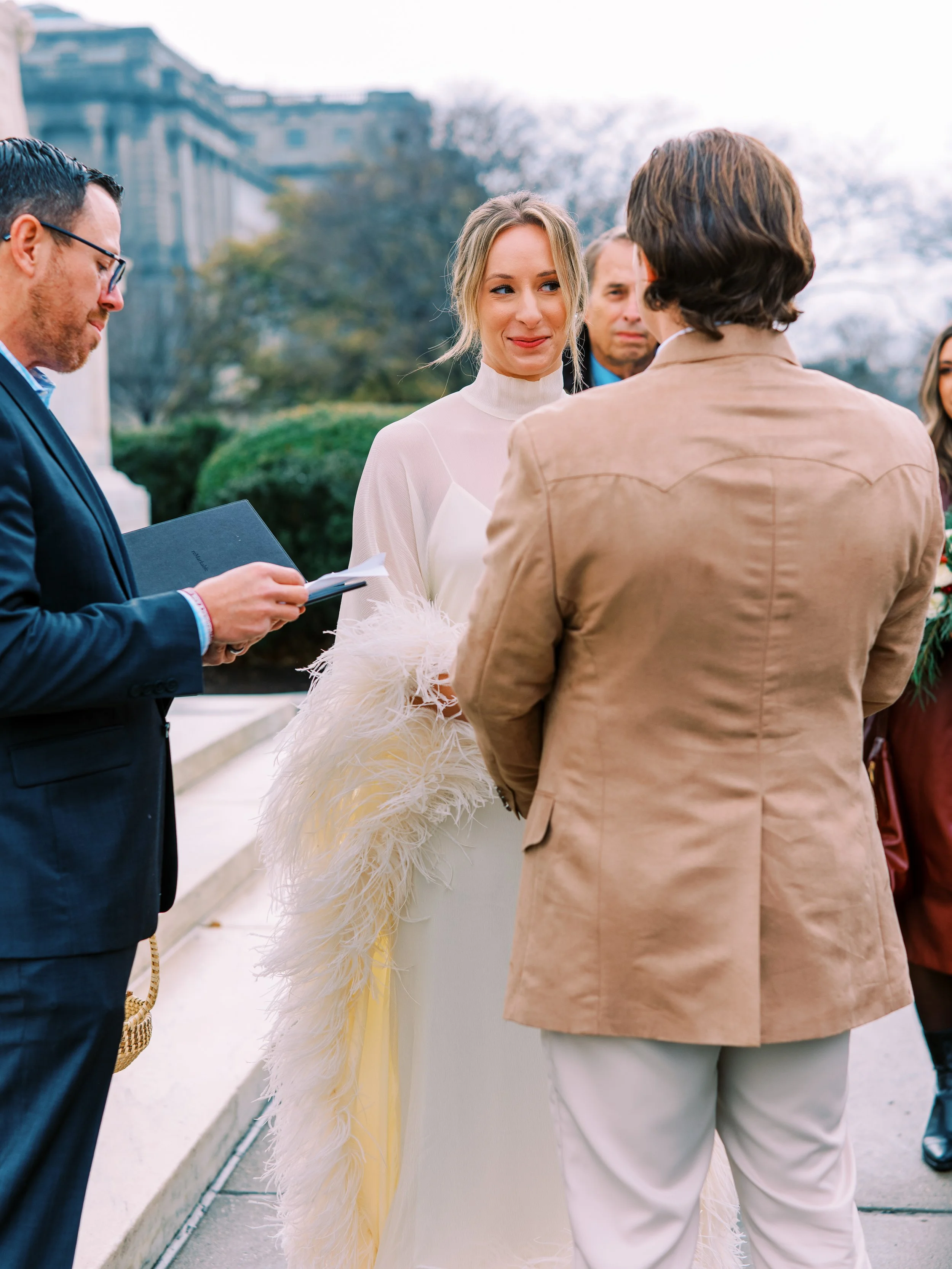 Officiant leading the elopement ceremony vows outdoors