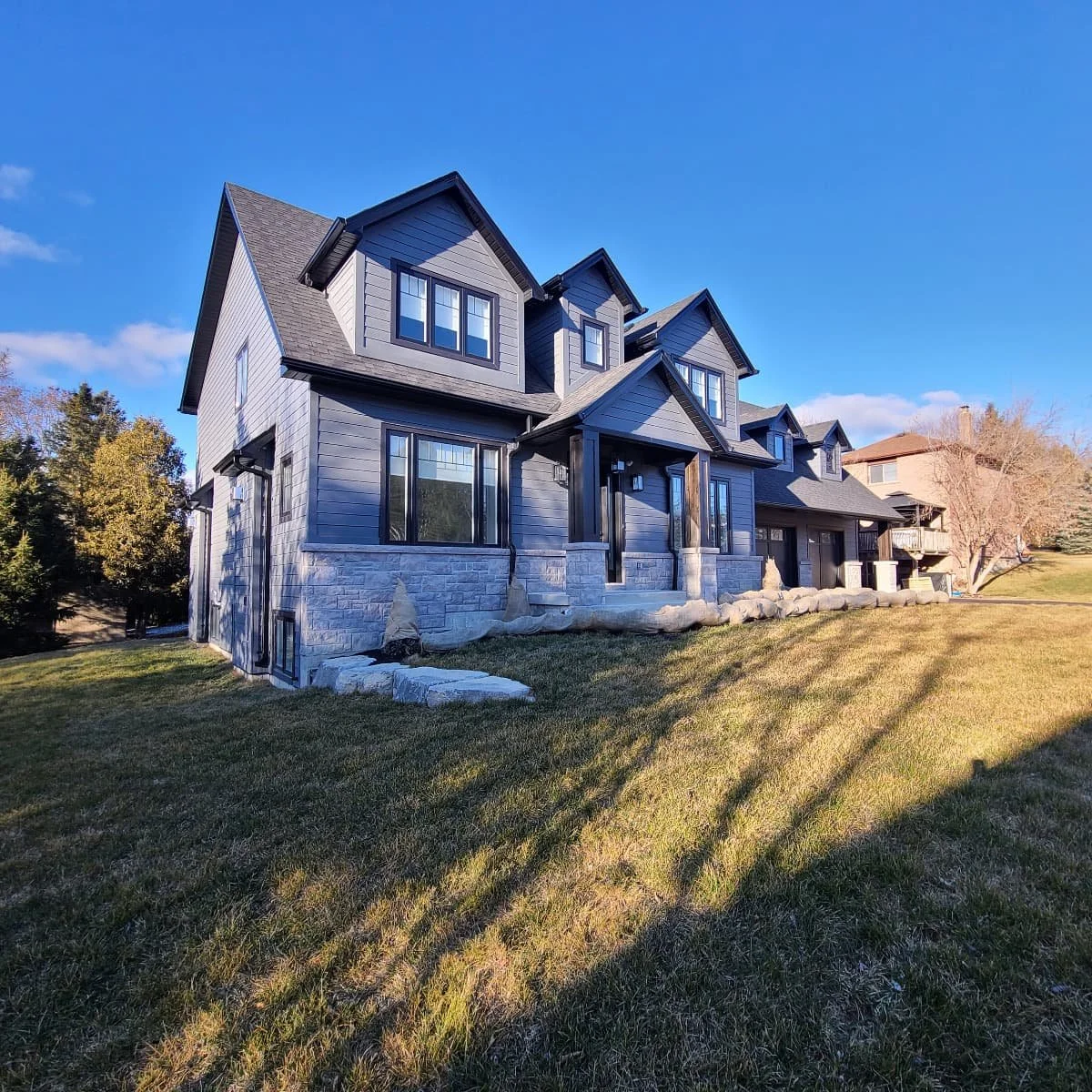 Two storey custom-built Cape Cod style home