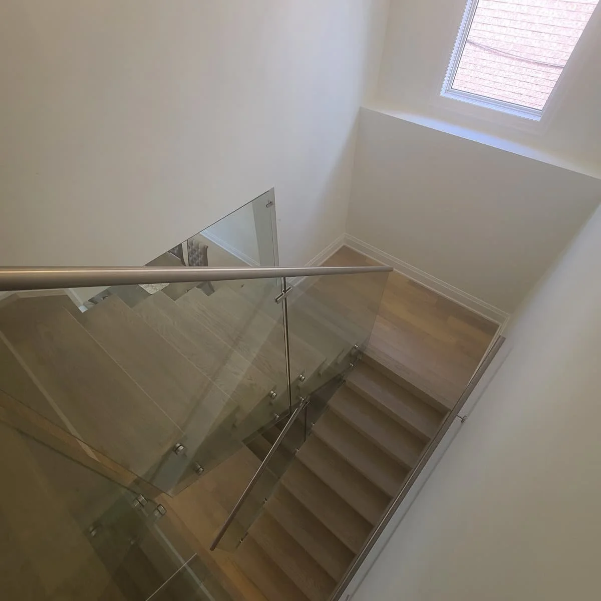 scissor stairs with light treads and glass guards .jpg