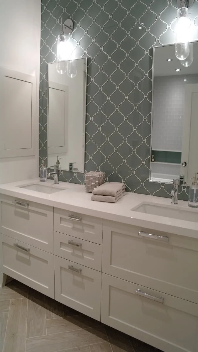 transitional bathroom with soft grey and green accents.jpg