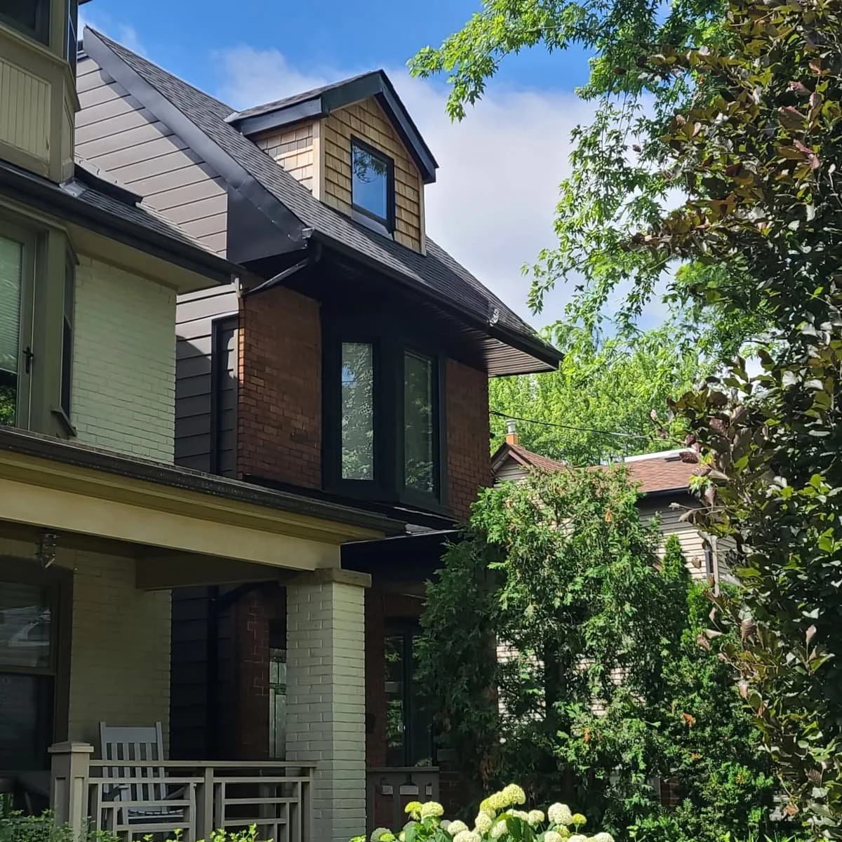 Traditional third storey addition to classic brick Toronto home