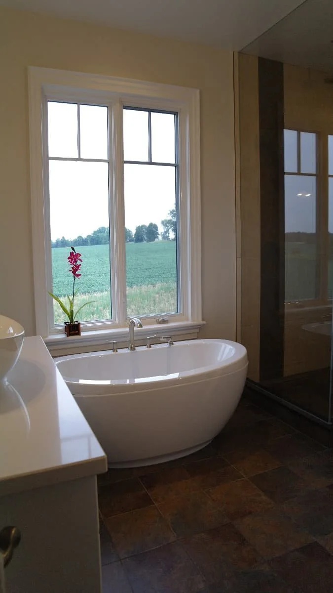 Freestanding white tub and shower.jpg