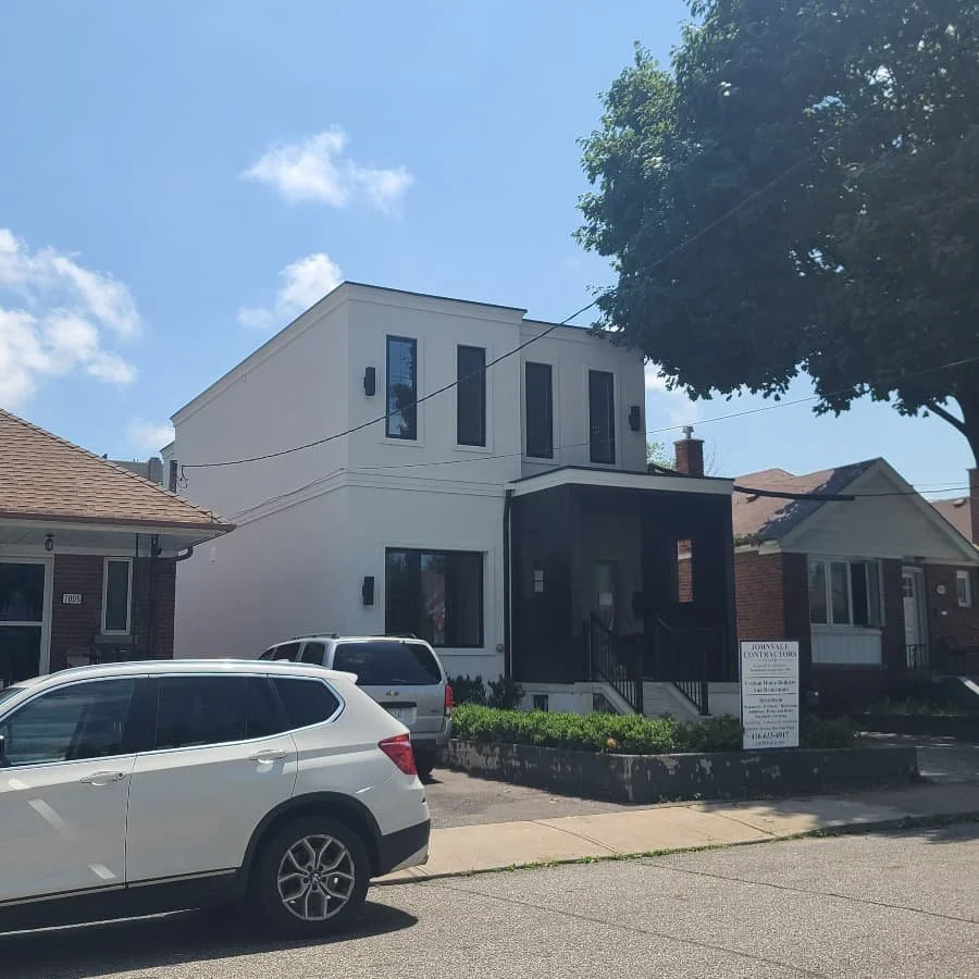 two storey addition with modern black front portico porch