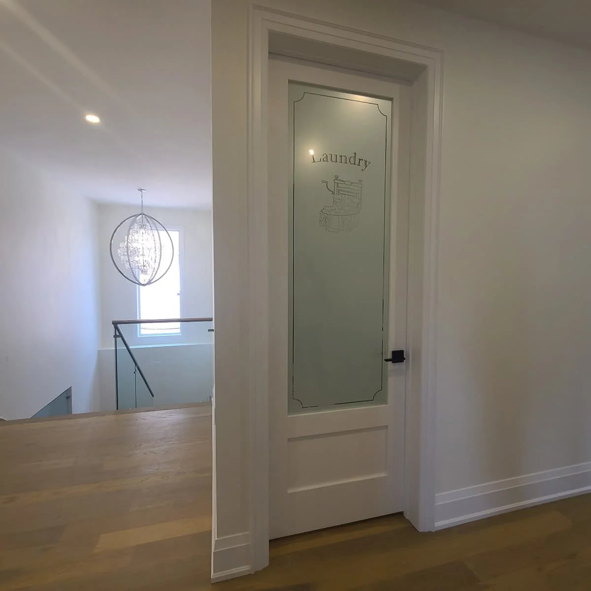modern airy hallway with open lighted stairwell.jpg