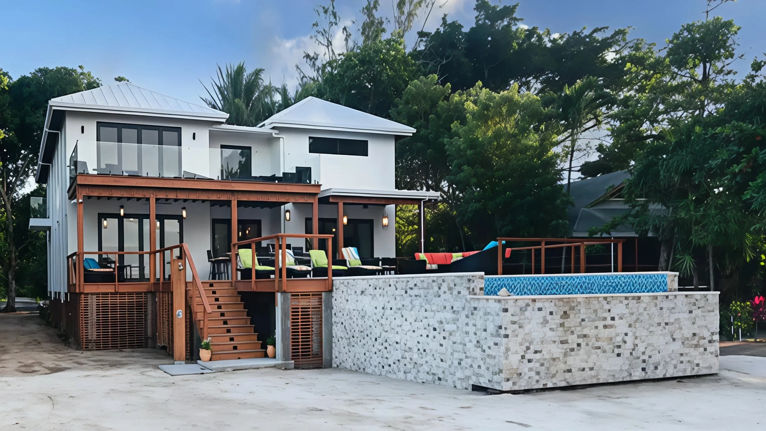 Honduras all white exterior custom hew home build with rear deck and lap pool on ocean.jpg