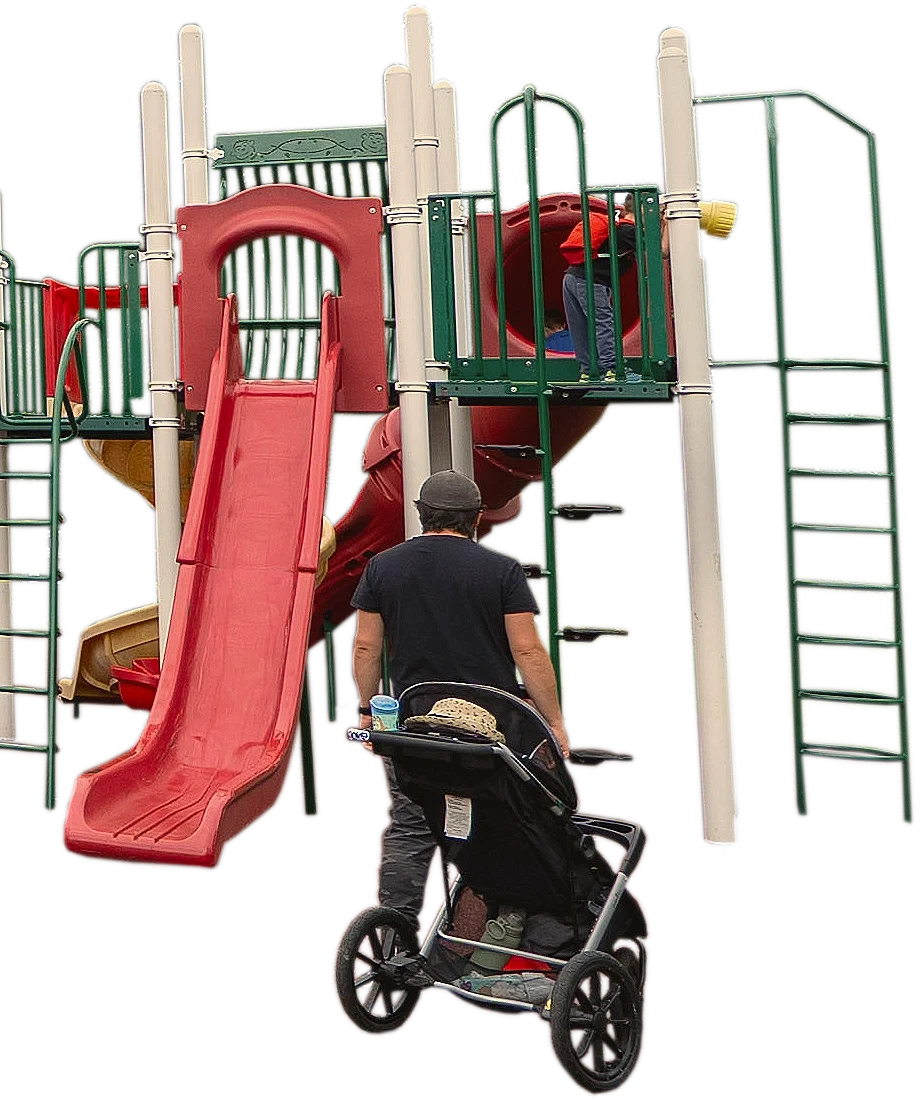 A playground structure at Acadia Park in Sackville, NS with a slide and a child climbing inside a tunnel. An adult with a stroller is nearby.