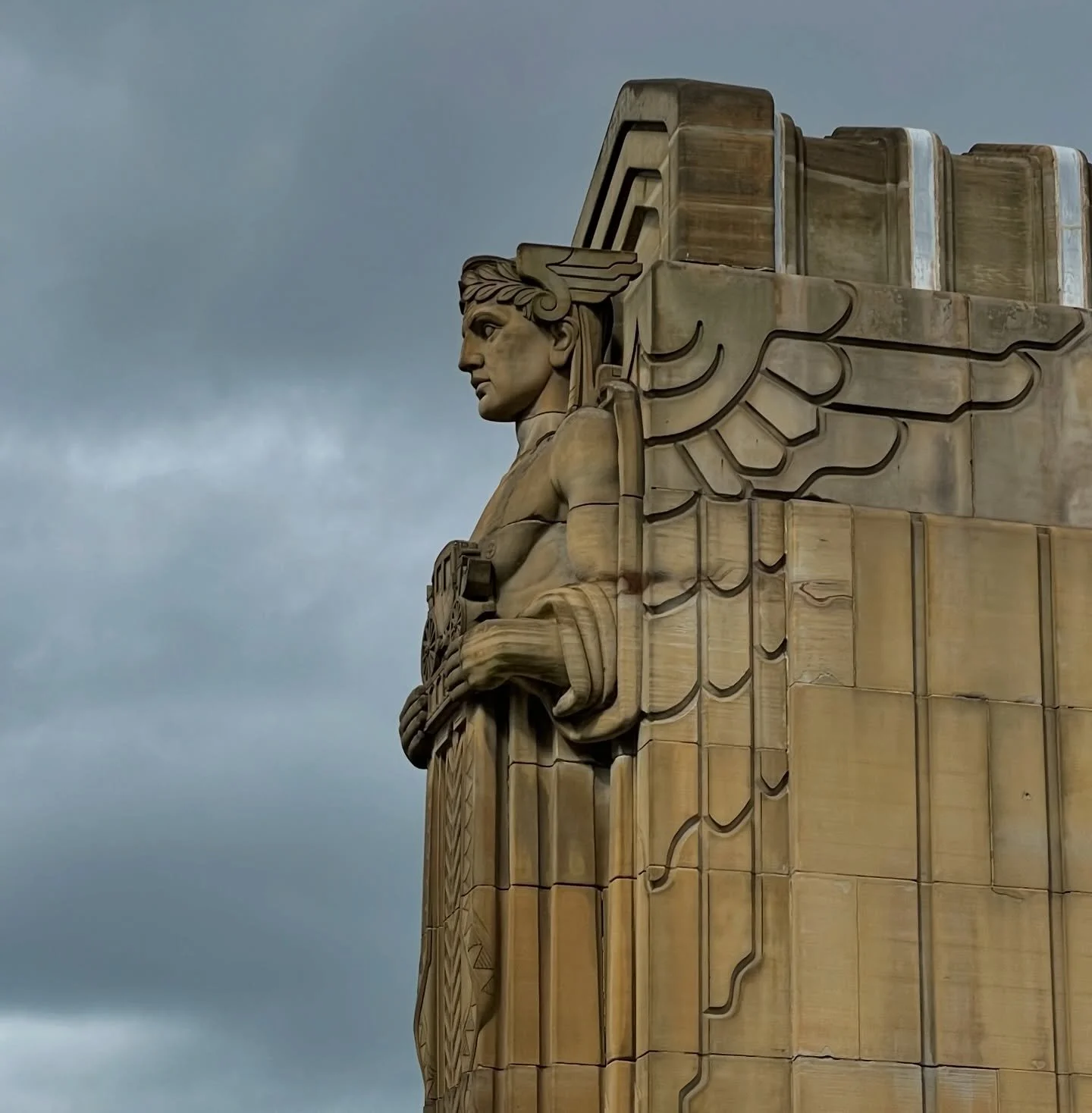 Carved stone Guardians of Traffic stand watch on Cleveland&rsquo;s Hope Memorial Bridge, their winged Art Deco forms rising against a restless sky. Built to honor progress and resilience, they frame the river crossing with strength and symmetry, remi