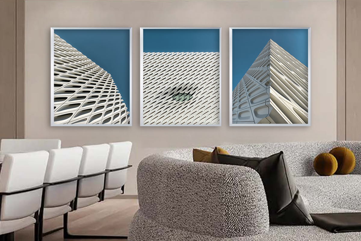 Architectural photograph featuring three framed studies of building facades with repeating patterns, displayed in a modern residential interior by Jay Britto.