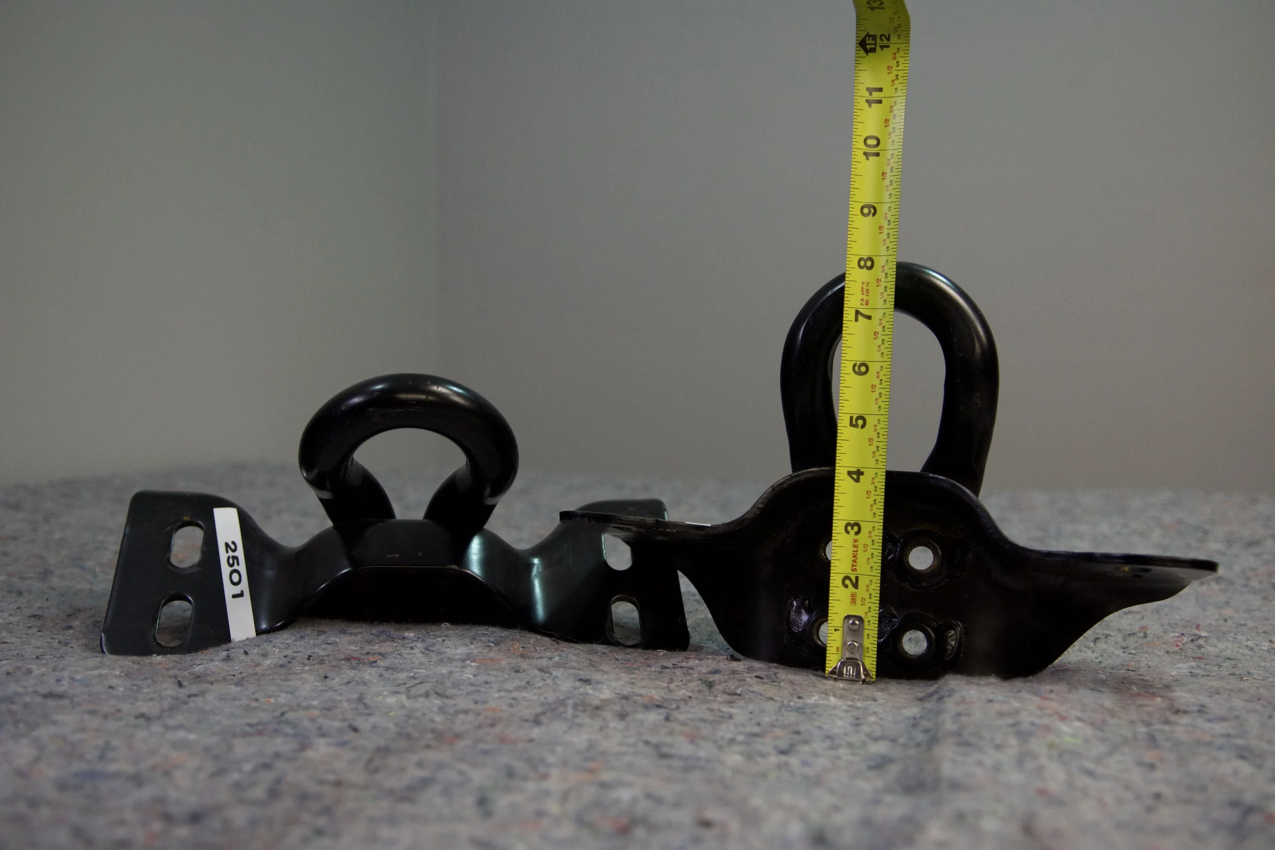 Close-up view of Ford Performance M-18954-SDR heavy-duty tow hooks for 2022 Ford Super Duty, designed for secure towing and vehicle recovery.