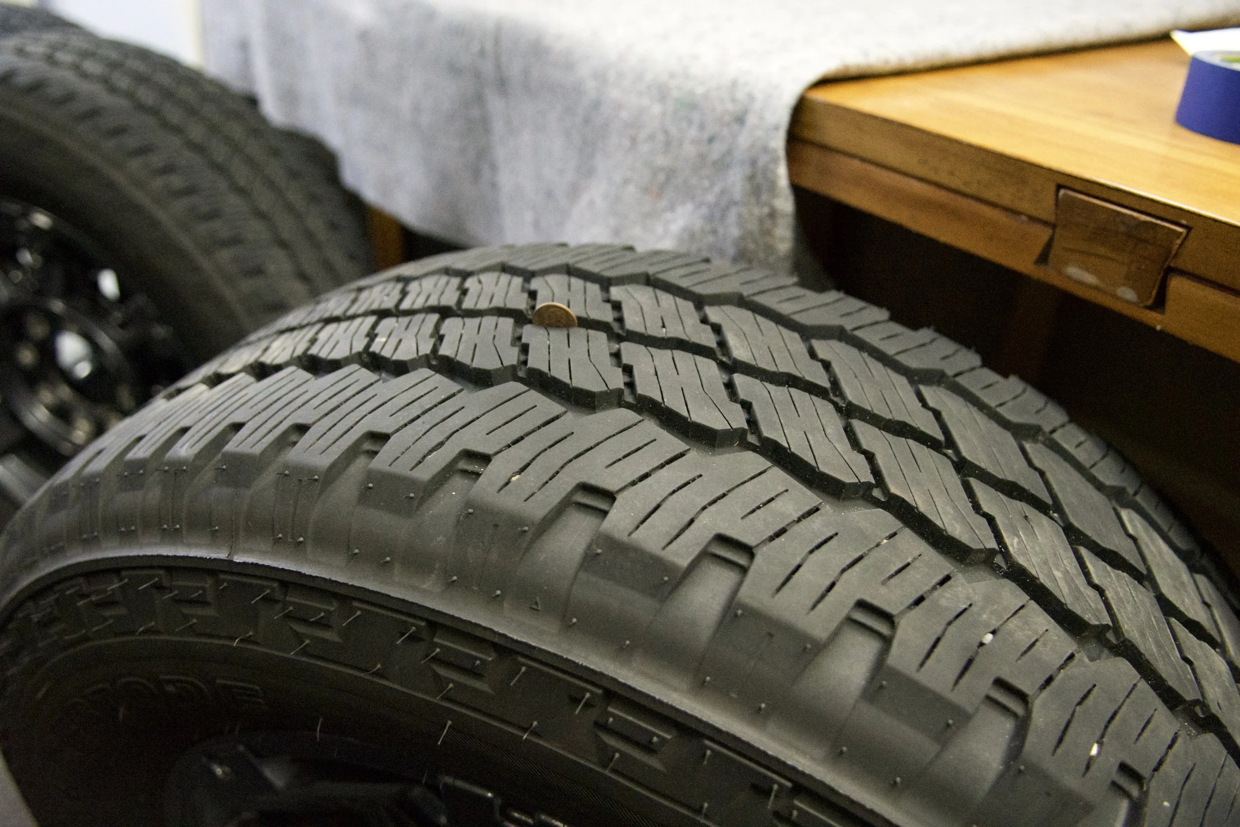 Bridgestone Dueler A/T LT275/65R20 all-terrain truck tire with 126/123R load rating and M+S rating, ideal for off-road and all-season driving.