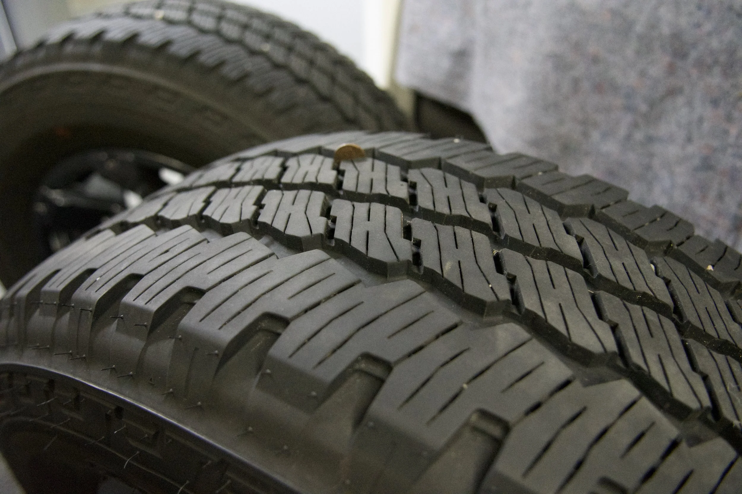 Bridgestone Dueler A/T LT275/65R20 all-terrain truck tire with 126/123R load rating and M+S rating, ideal for off-road and all-season driving.