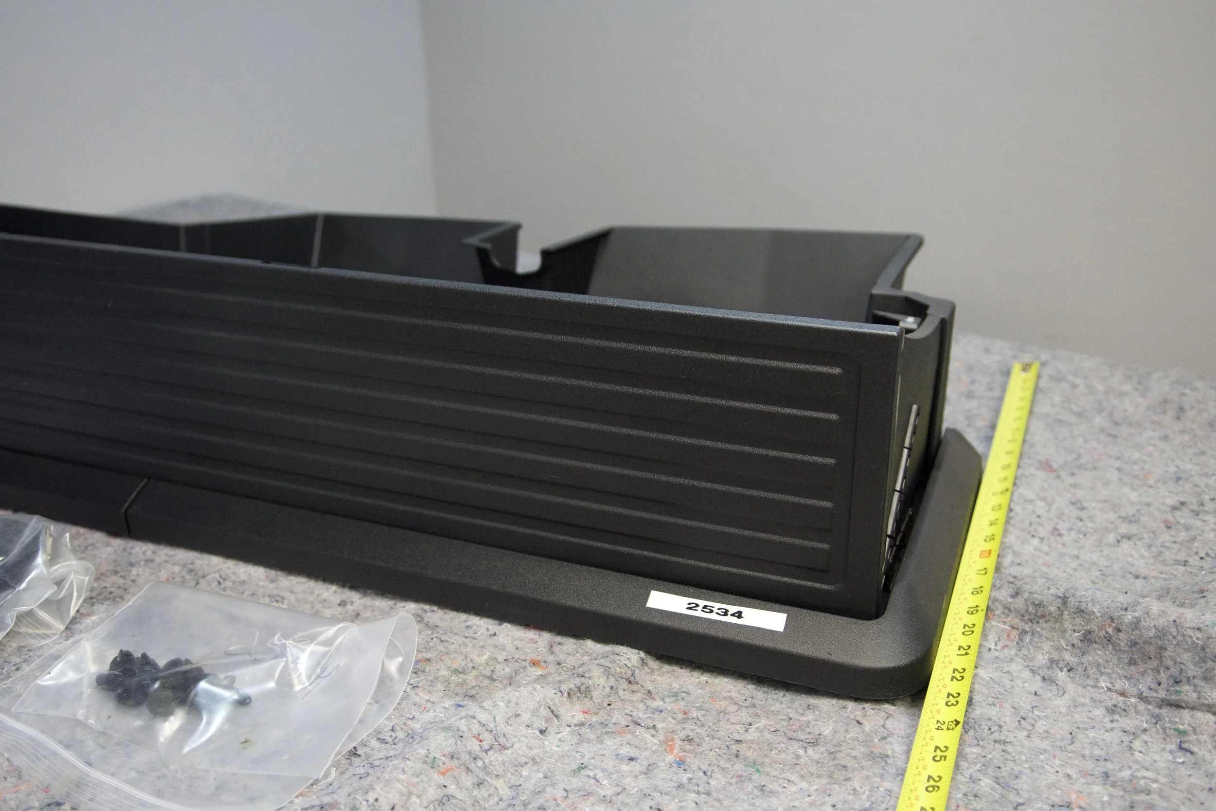 OEM 2017–2025 Ford Super Duty Crew Cab rear underseat storage bin, heavy-duty molded plastic, perfect fit for F-250, F-350, and F-450 models.