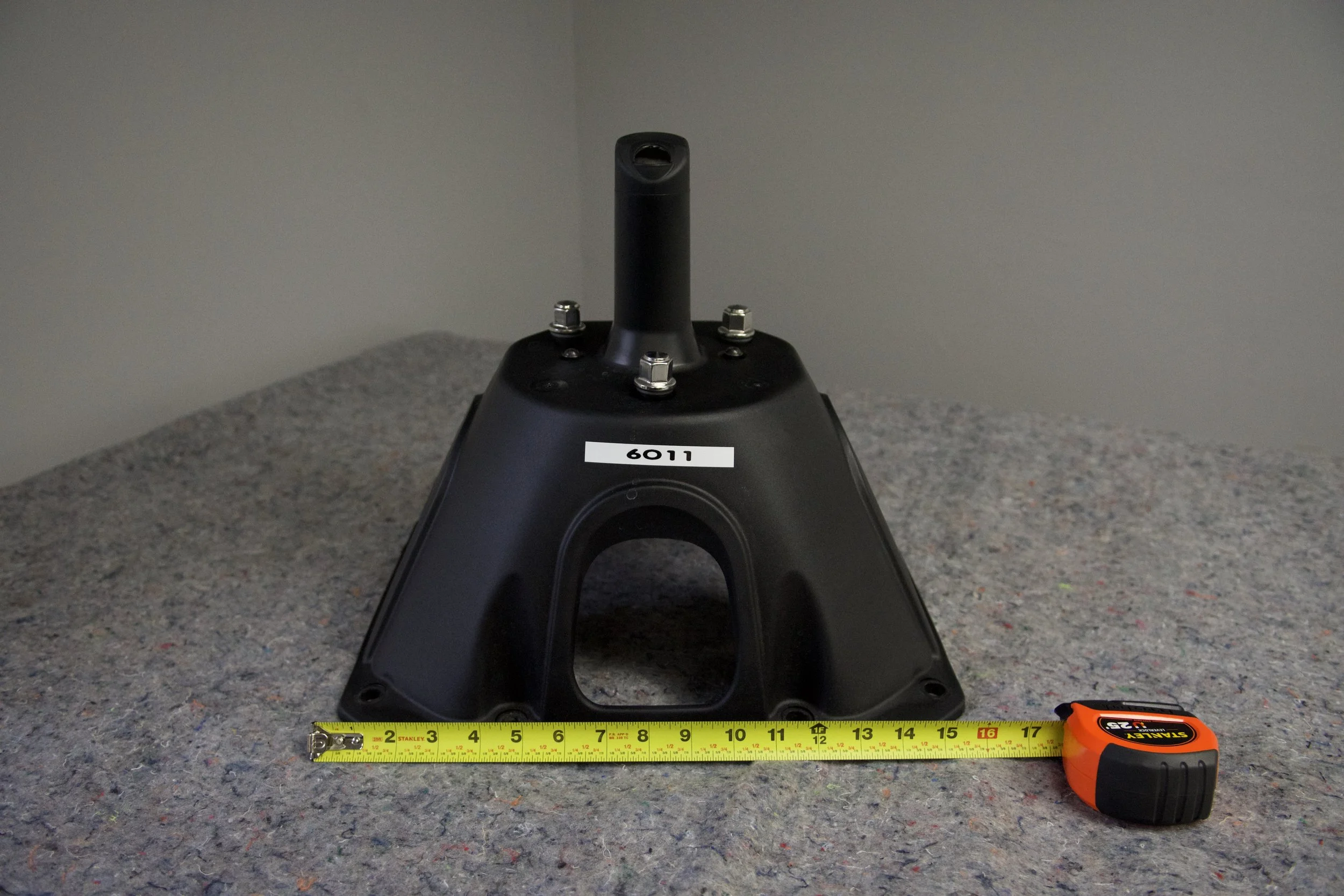 Ford Bronco 6G OEM spare tire holder – factory take-off part (#6011) shown on display table, no mounting hardware included