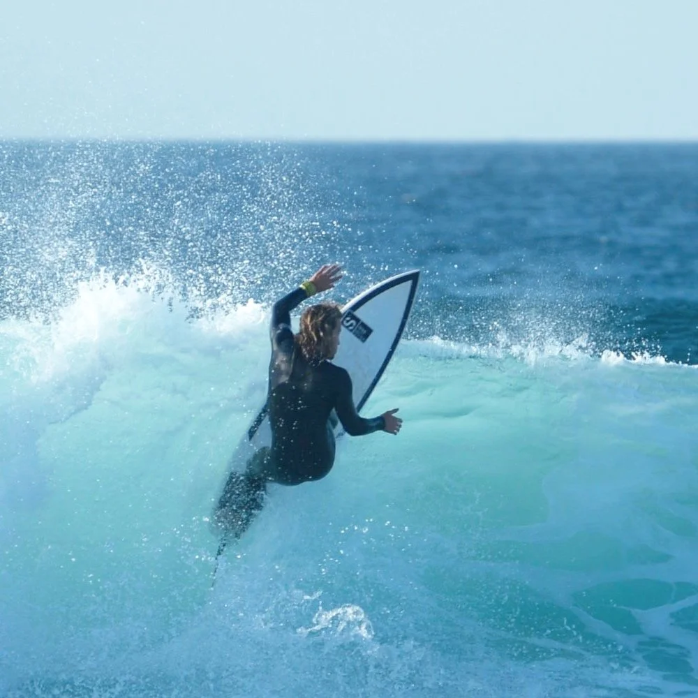 Surfer performing off the lip Algarve Portugal