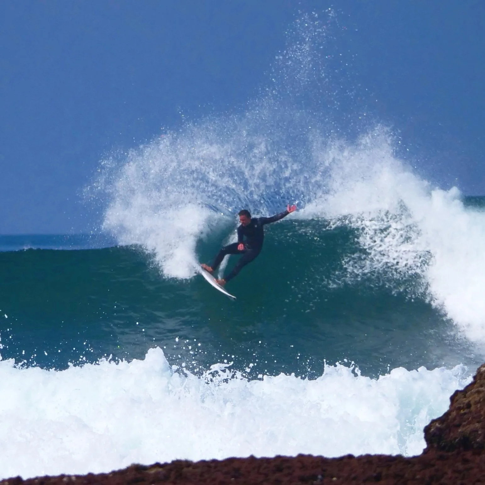 Surfer performing cut back Coxos Ericeira Portugal