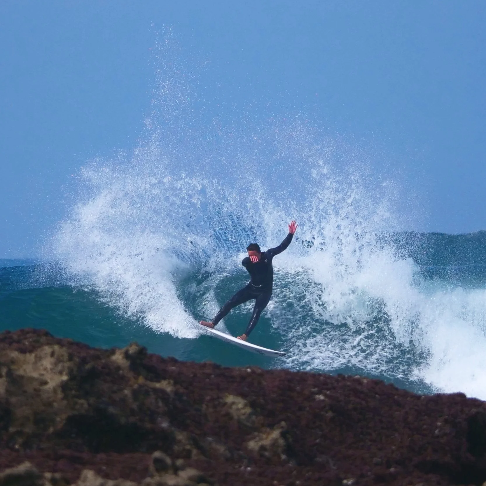 Surfer driving through cutback Coxos Portugal