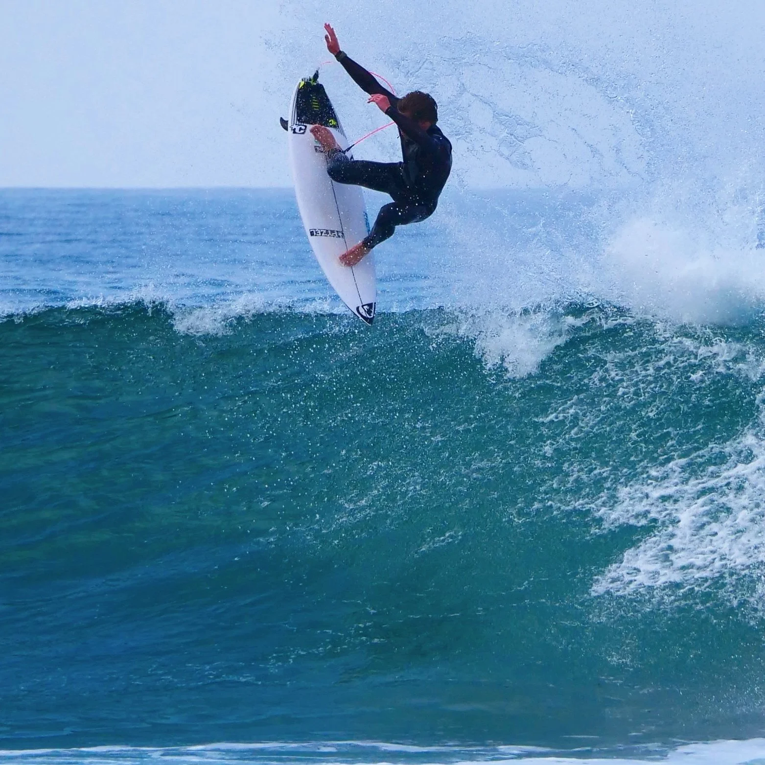 Surfer tail high air Alentejo Portugal