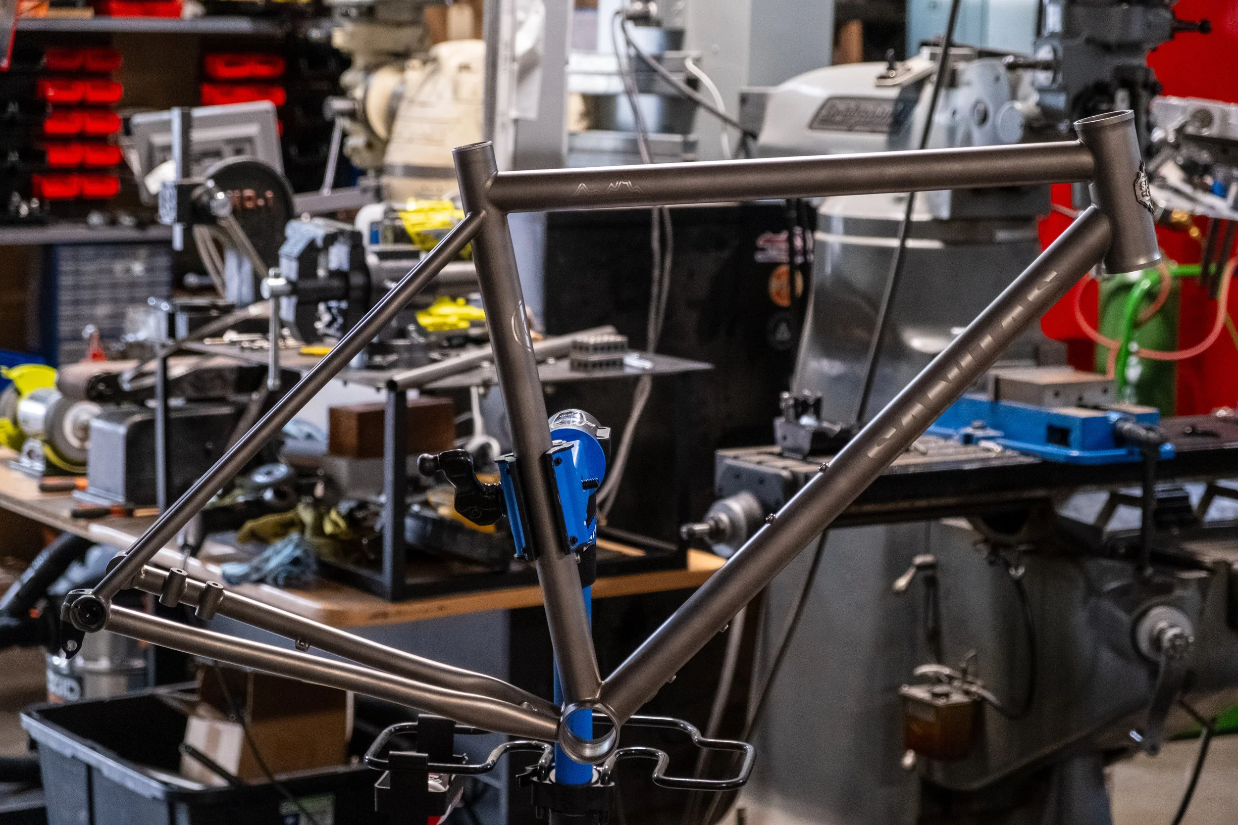 A stylized electronic display showing a fluctuating line graph with peaks and valleys, resembling a financial or stock market chart, with a black background and gray grid lines.