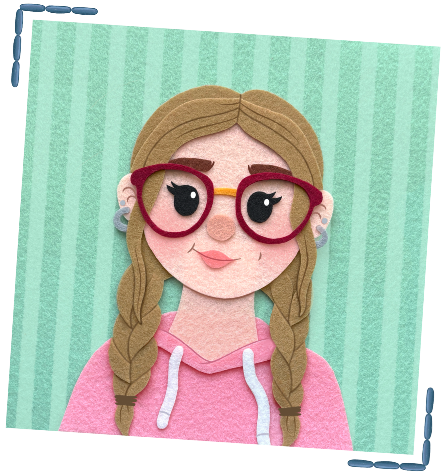 A portrait made of felt of a blonde girl with two braids in her hair and red glasses. She wears a pink hoodie and stands in front of a teal, striped background.