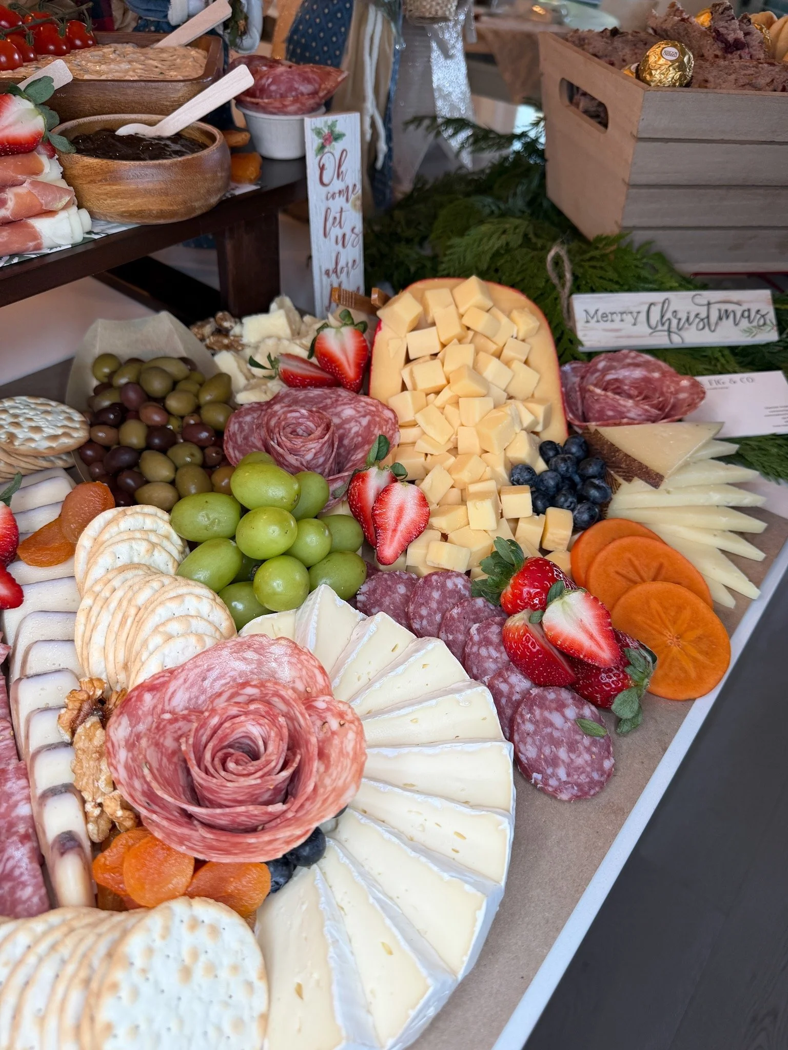 Flat lay grazing table styled with artisan cheeses and fresh fruit in Nocatee, Florida.