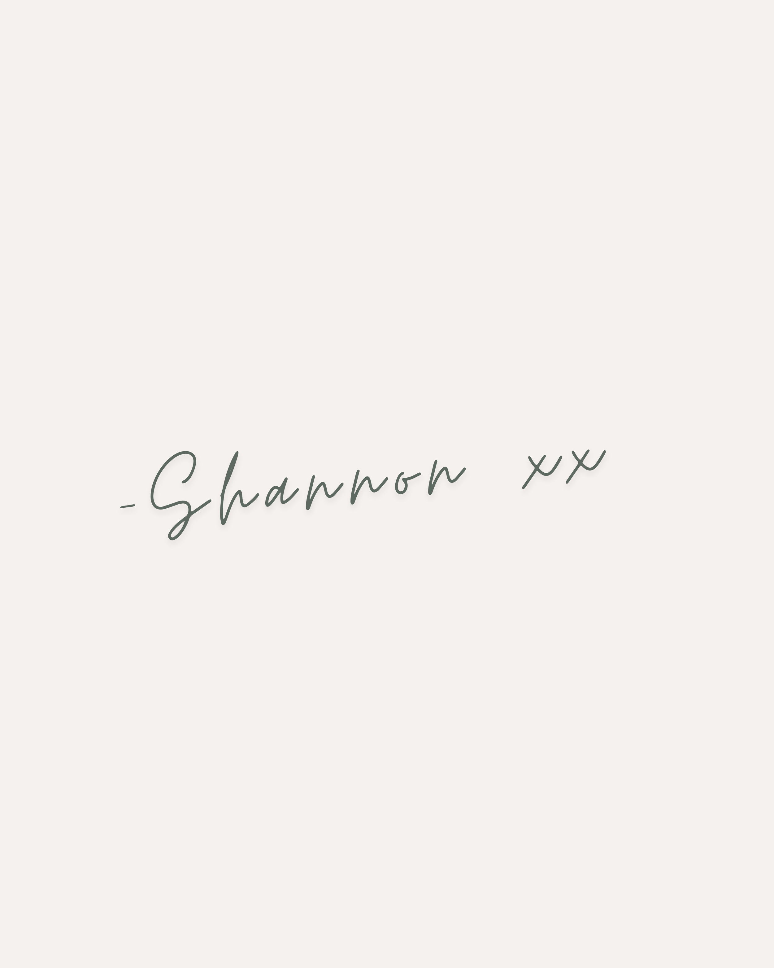 A white greeting card with the words 'Celebrating you' written in elegant cursive font, and 'Shannon xx' written below in the same style.