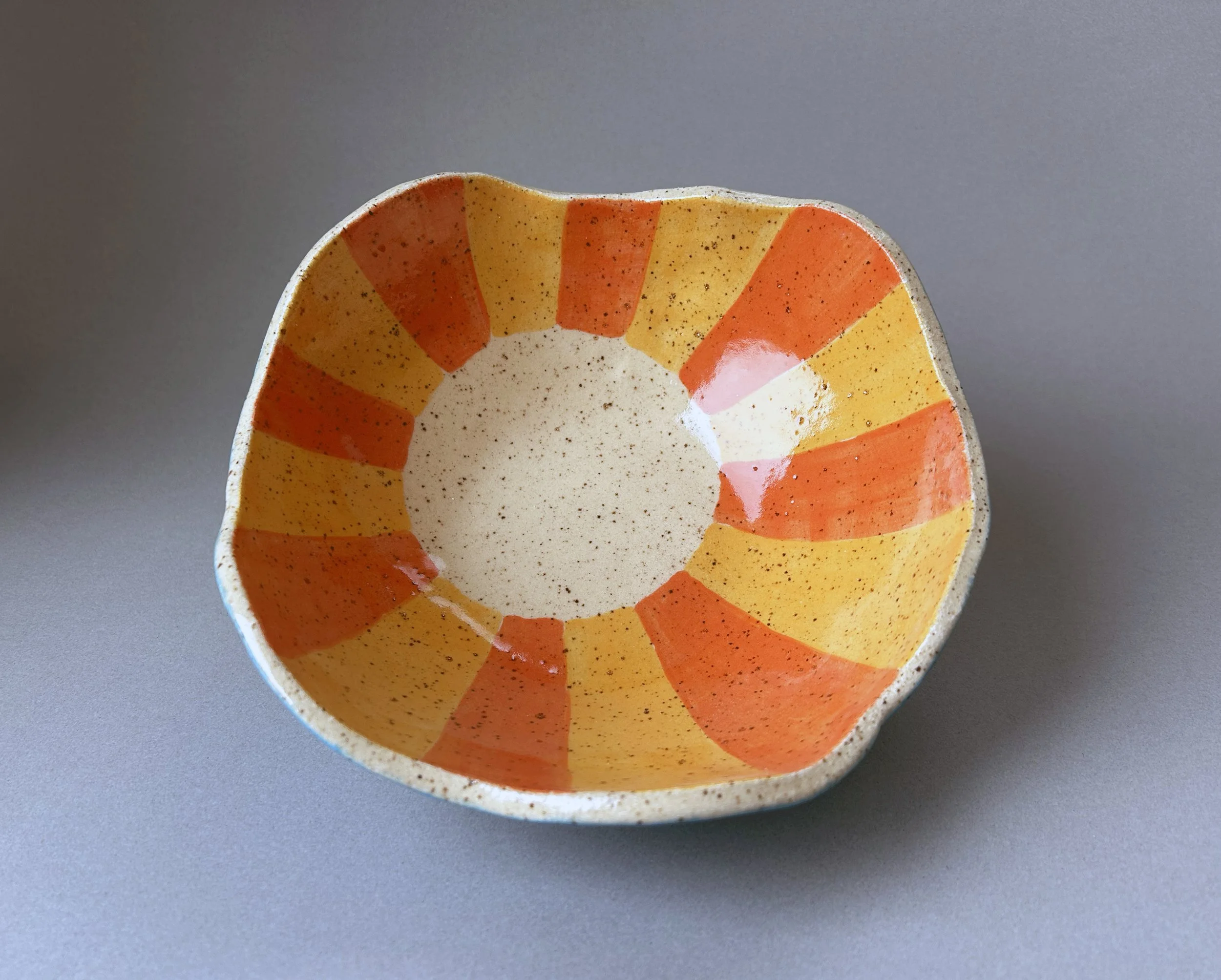 yellow and orange sunburst stoneware bowl.jpg