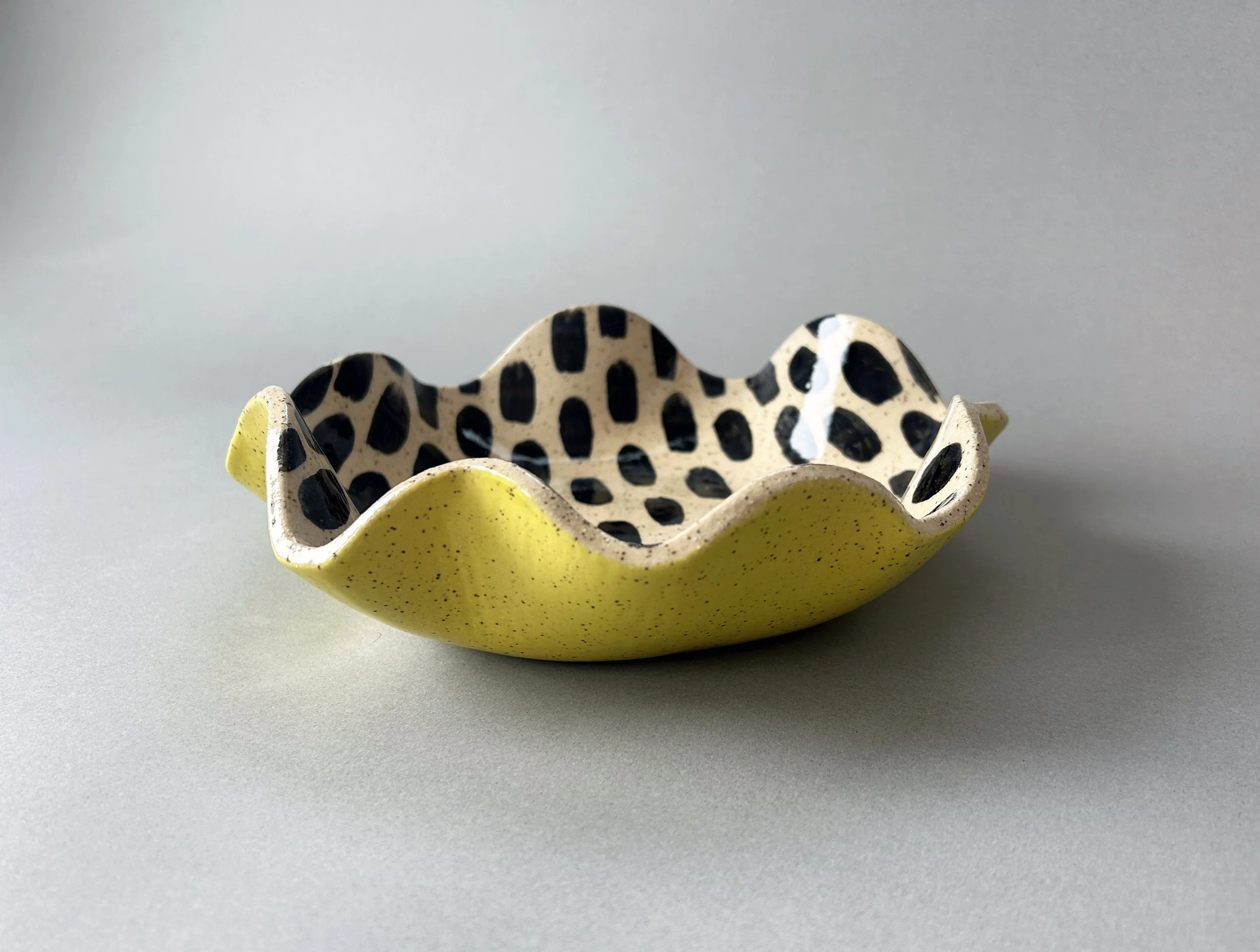 yellow black dot stoneware wiggle dish.jpg