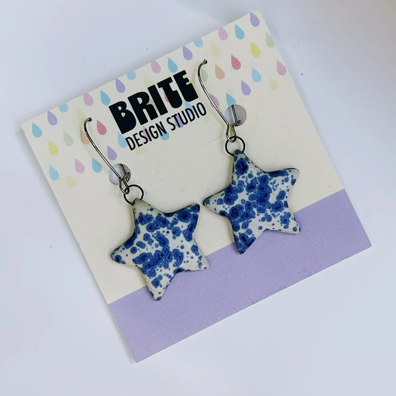 blue speckle star dangle earrings.jpg
